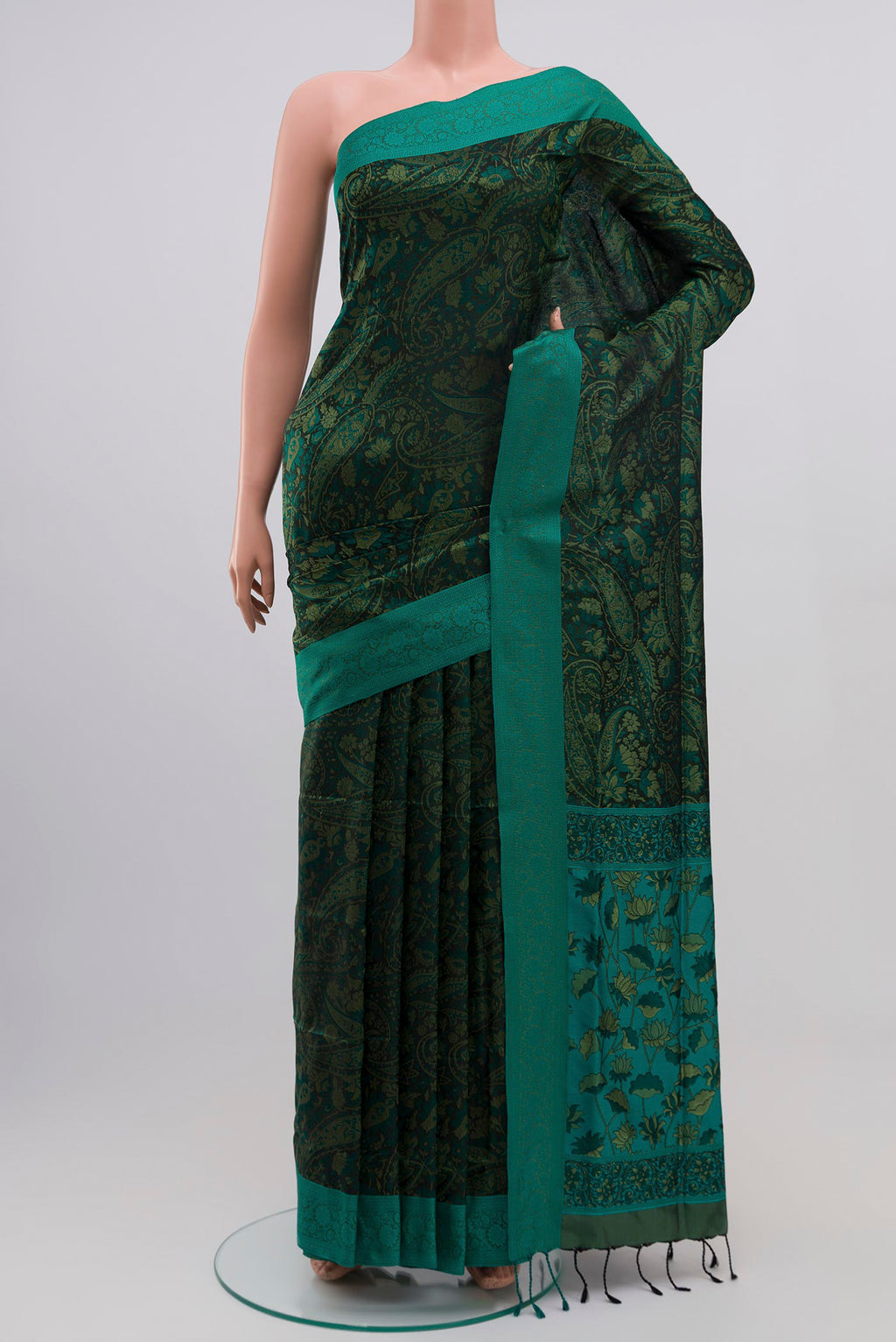 Green Soft Silk Saree with Jacquard design on the body and Thread Border.  displayed on a mannequin