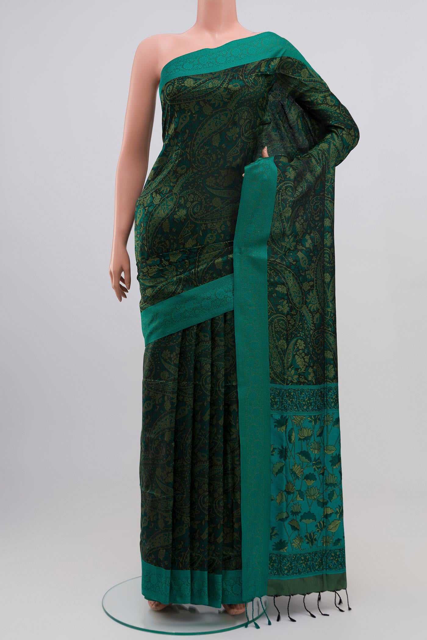 Green Soft Silk Saree with Jacquard design on the body and Thread Border.  displayed on a mannequin