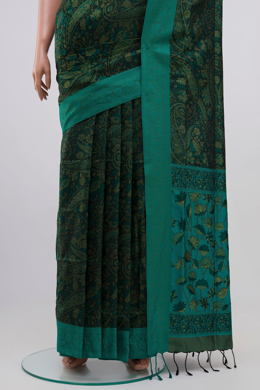 Pleats and pallu of Green Soft Silk Saree with Jacquard design on the body and Thread Border. 