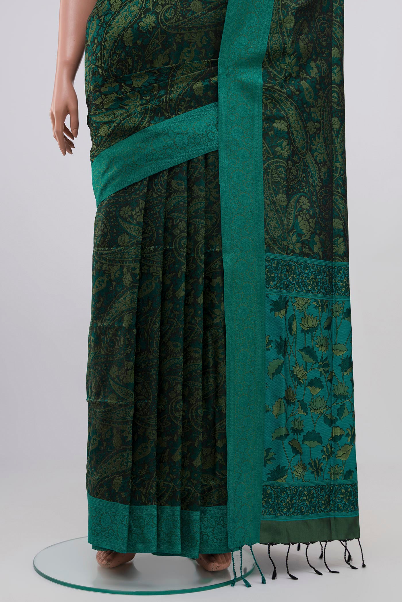 Pleats and pallu of Green Soft Silk Saree with Jacquard design on the body and Thread Border. 