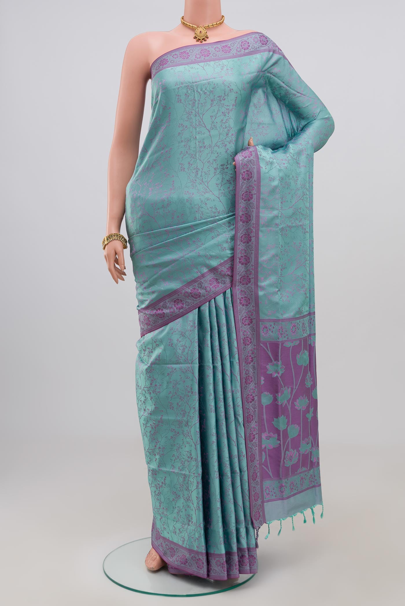 Blue Soft Silk Saree with Jacquard design on the body and Thread Border.  displayed on a mannequin