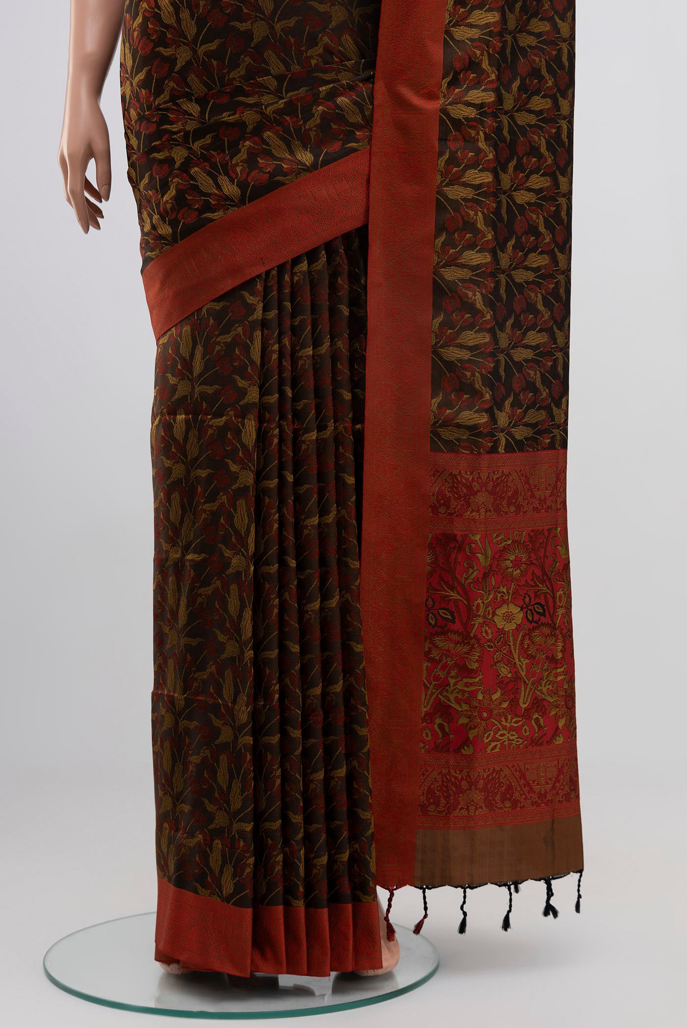 Pleats and pallu of Brown Soft Silk Saree with Jacquard design on the body and Thread Border. 