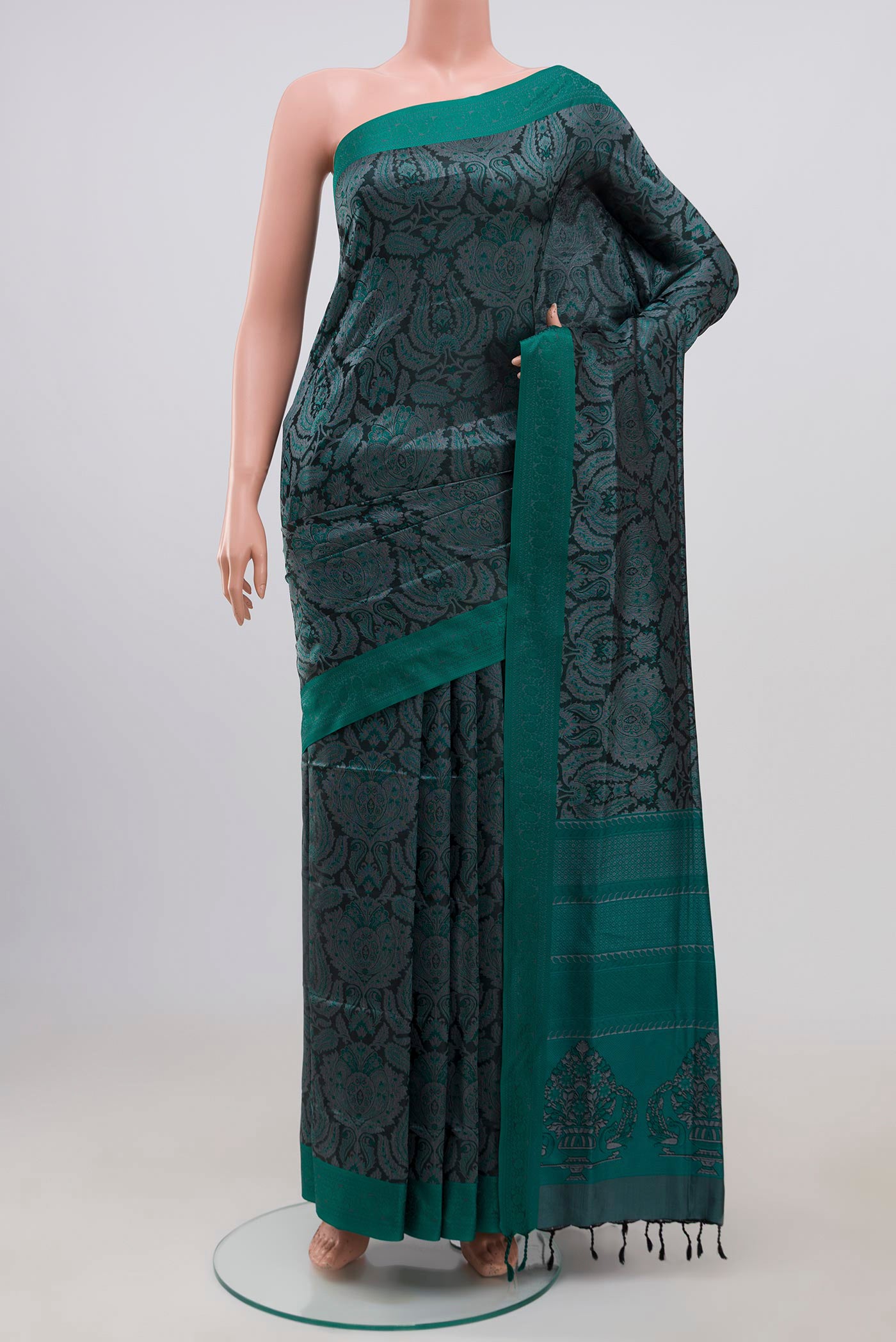 Black Soft Silk Saree with Jacquard design on the body and Thread Border.  displayed on a mannequin