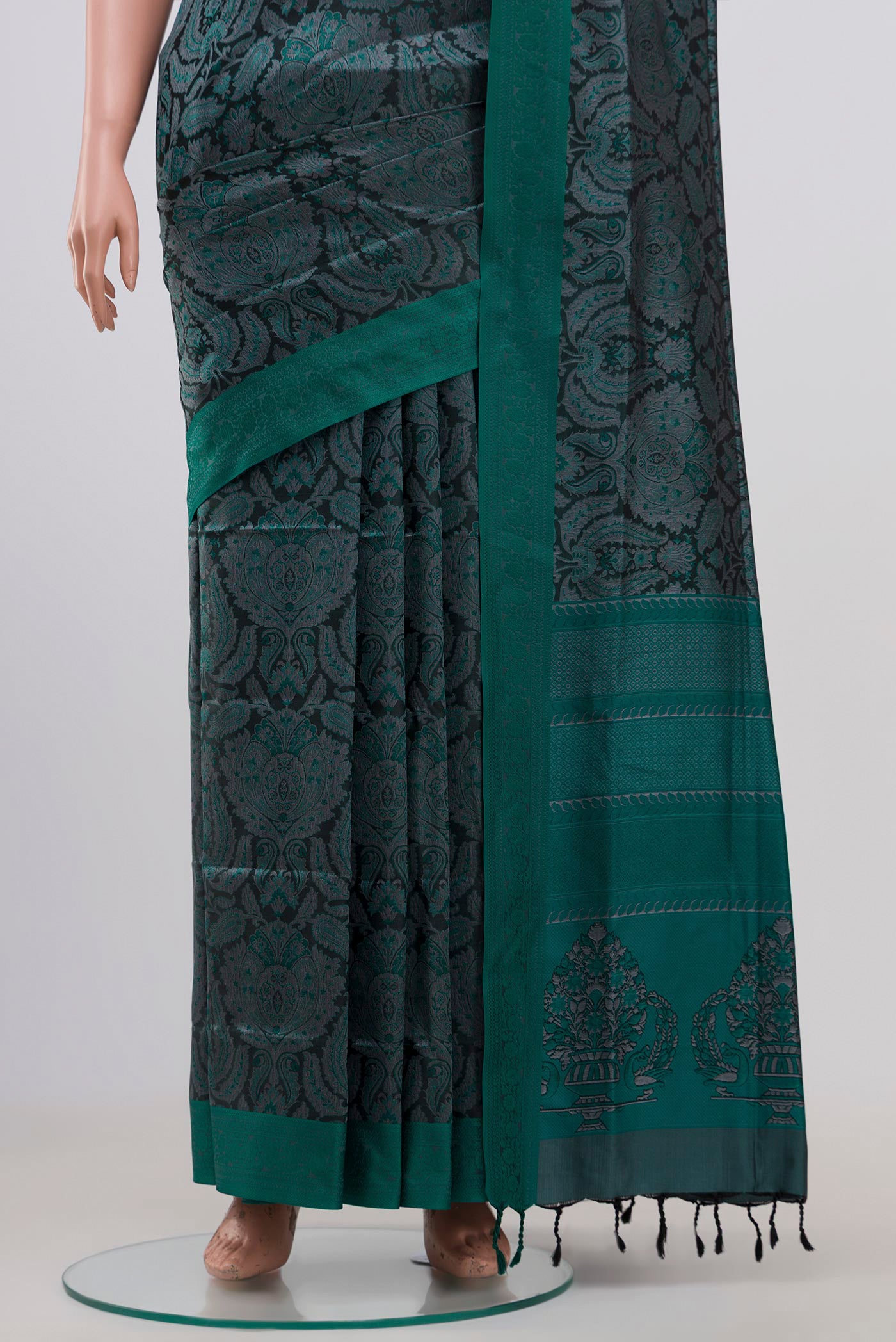 Pleats and pallu of Black Soft Silk Saree with Jacquard design on the body and Thread Border. 