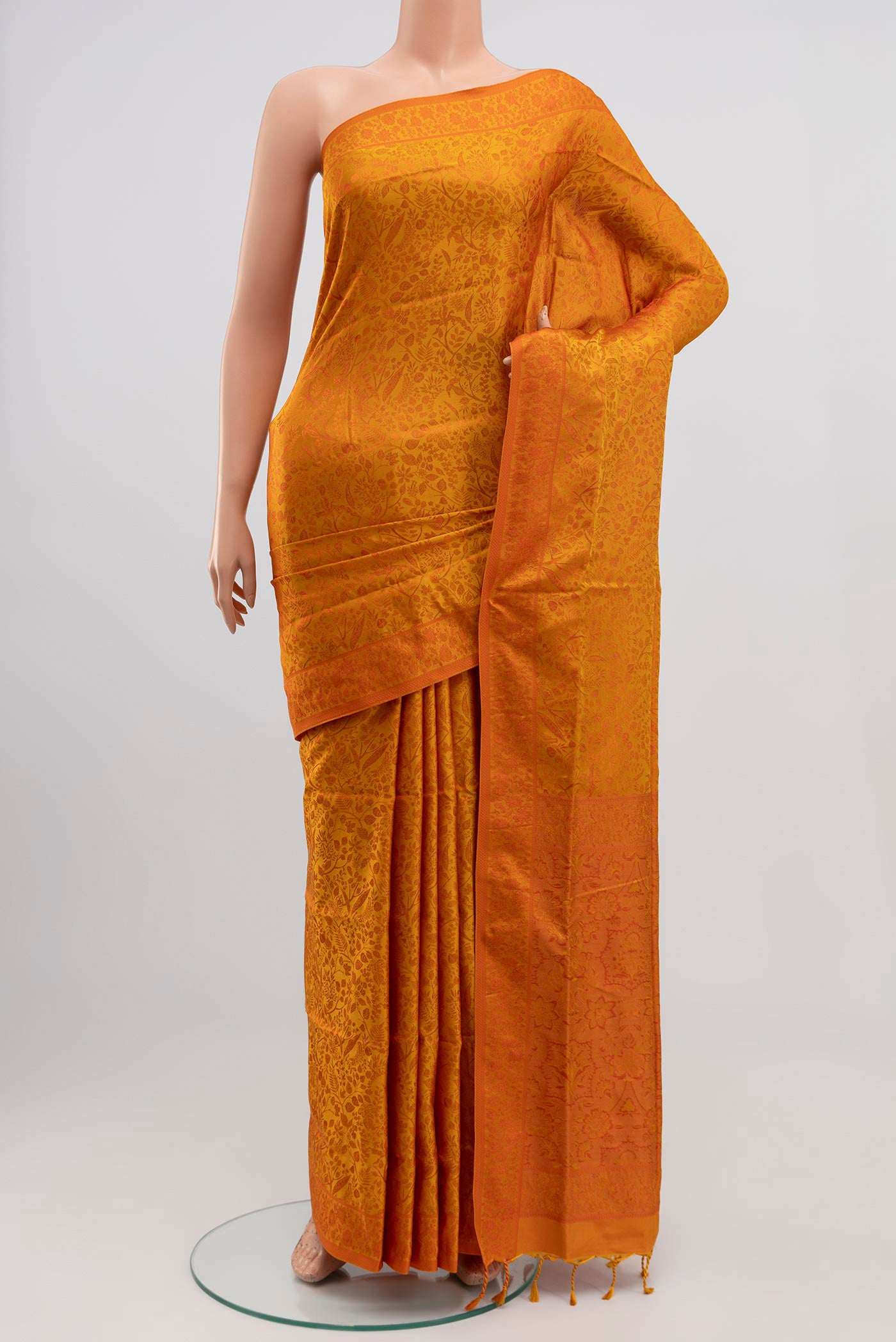 Yellow Soft Silk Saree with Jacquard design on the body and Thread Border.  displayed on a mannequin