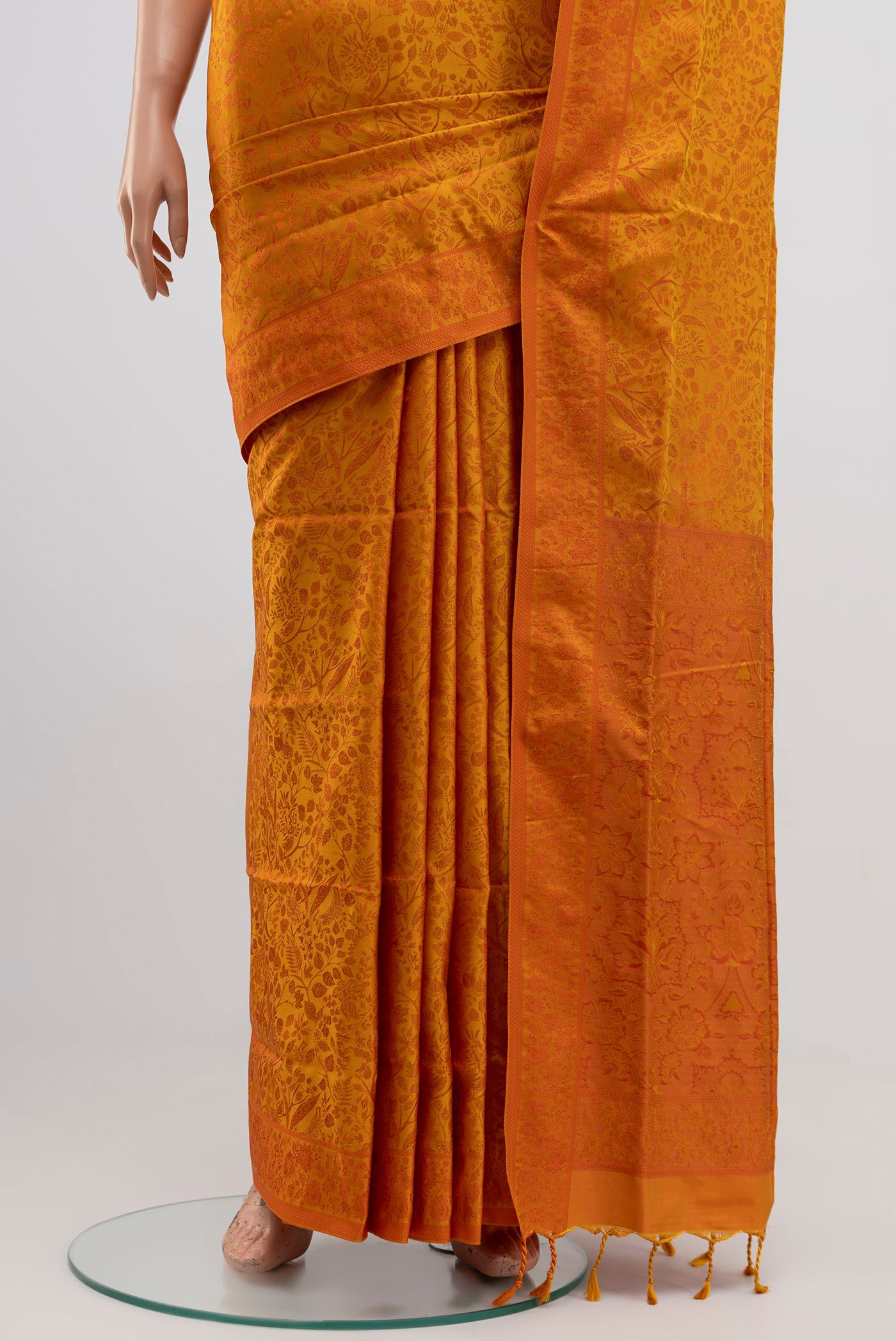 Pleats and pallu of Yellow Soft Silk Saree with Jacquard design on the body and Thread Border. 