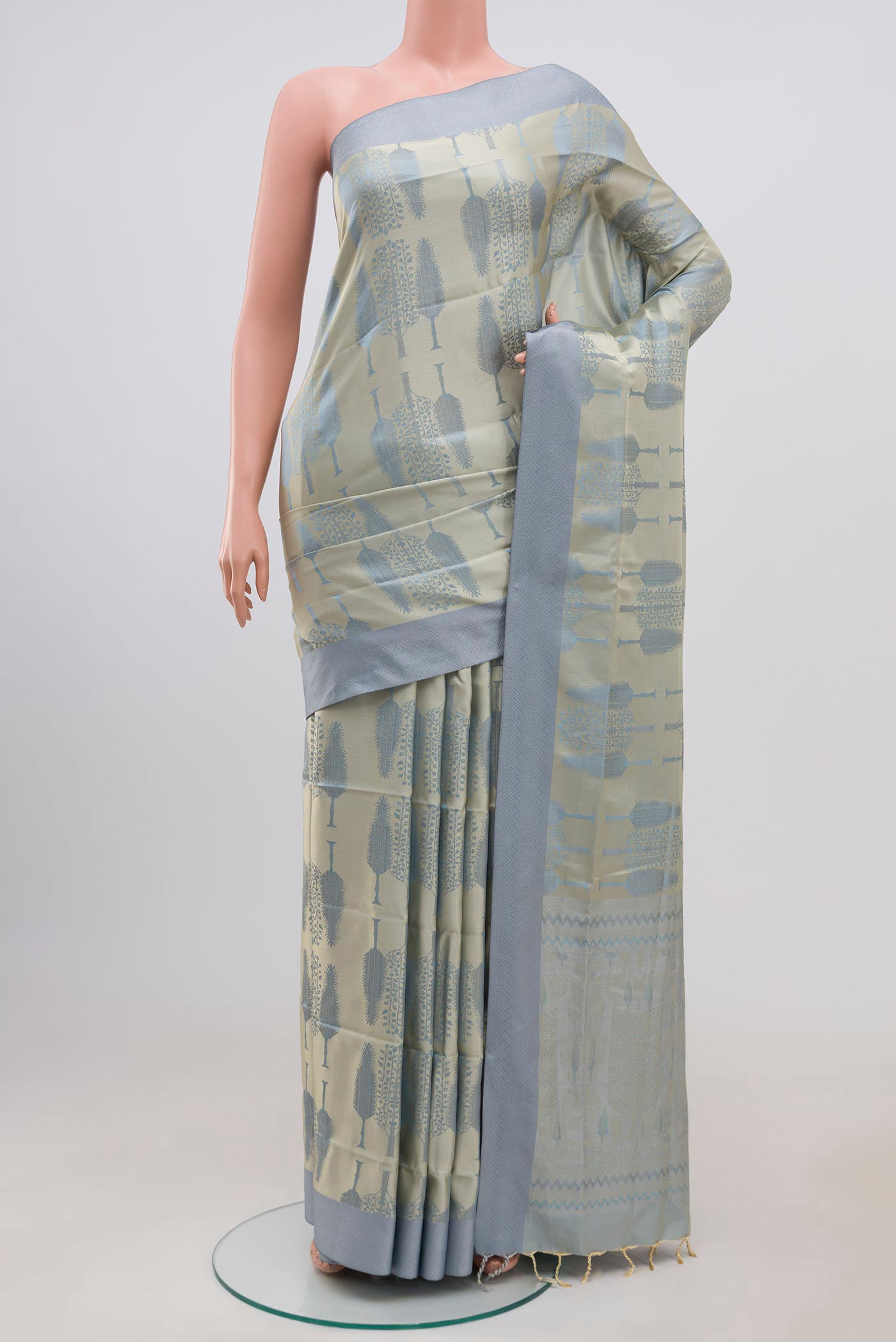 Grey Soft Silk Saree with Jacquard design on the body and Thread Border.  displayed on a mannequin