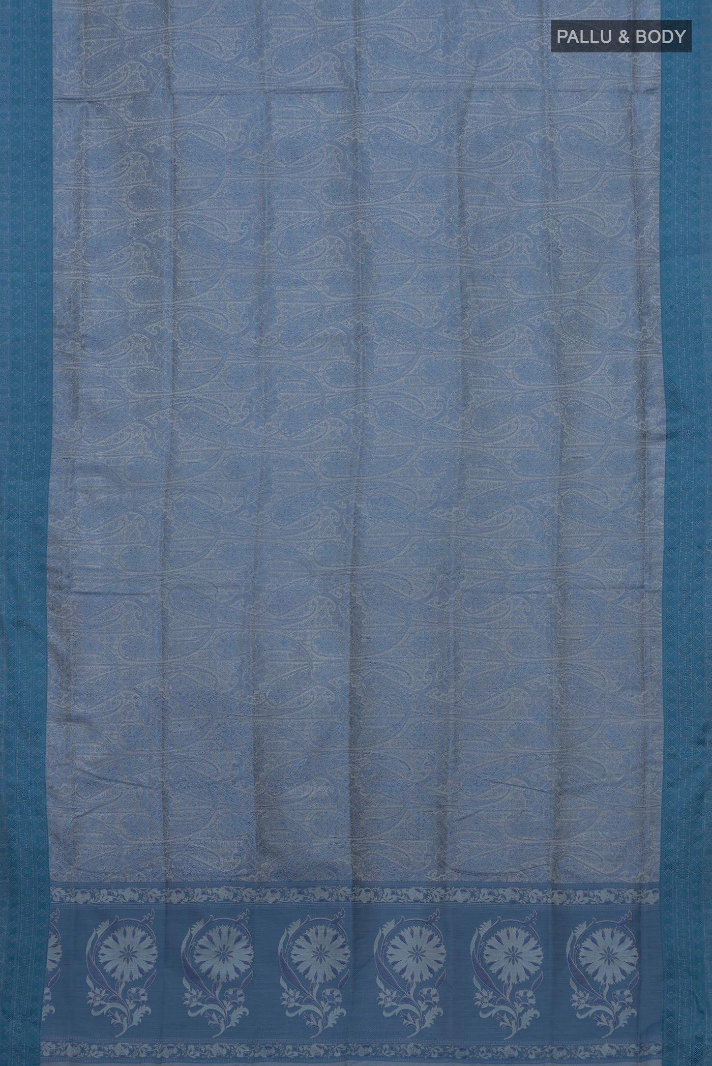 Flat view of Blue Soft Silk Saree with Jacquard design on the body and Thread Border. 