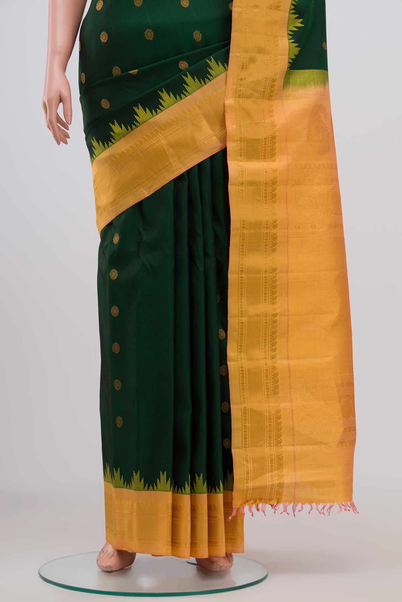 Pleats and pallu of Green Gadwal Silk Saree with Zari Butta on the body and Zari Border. 