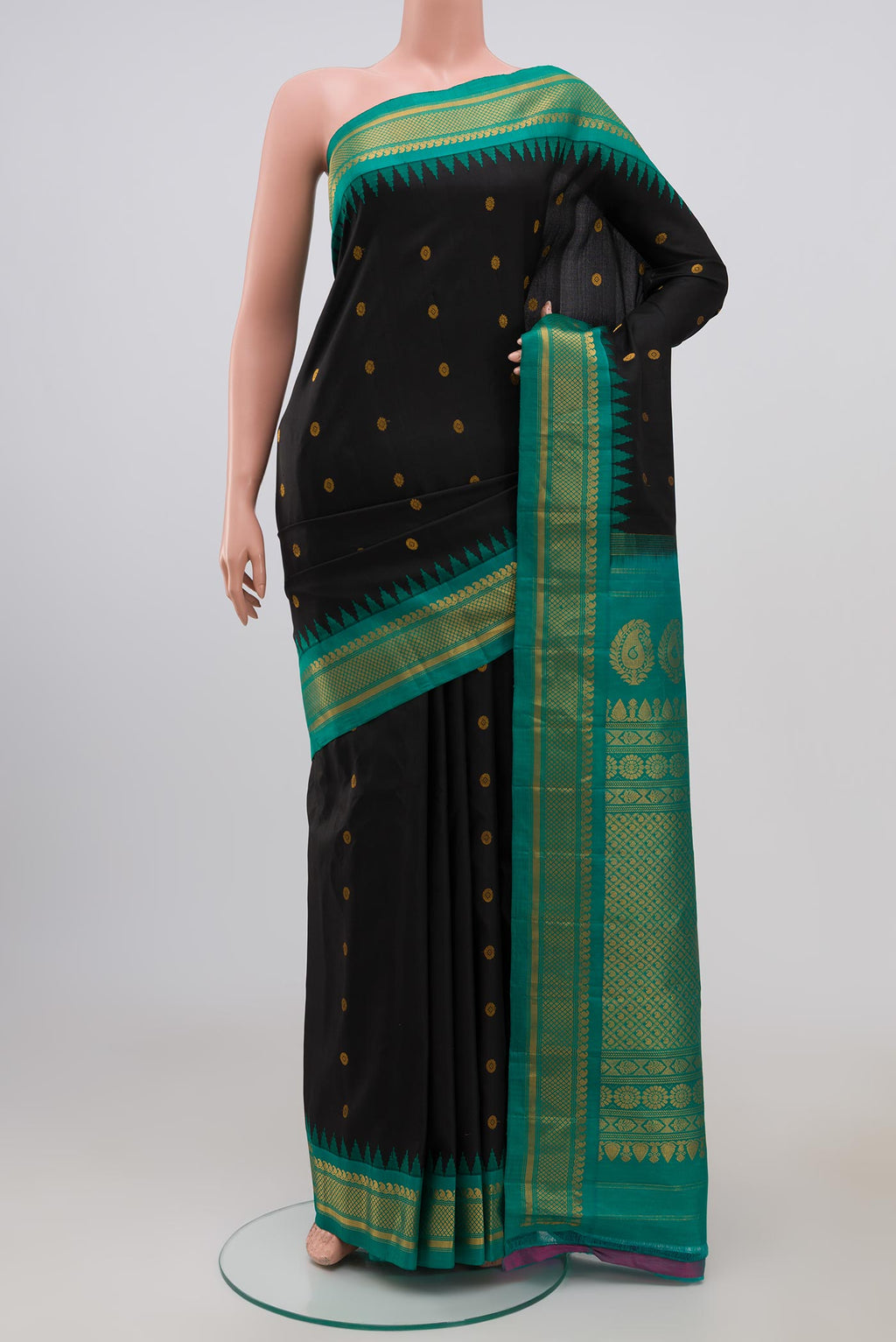 Black Gadwal Silk Saree with Zari Butta on the body and Zari Border.  displayed on a mannequin