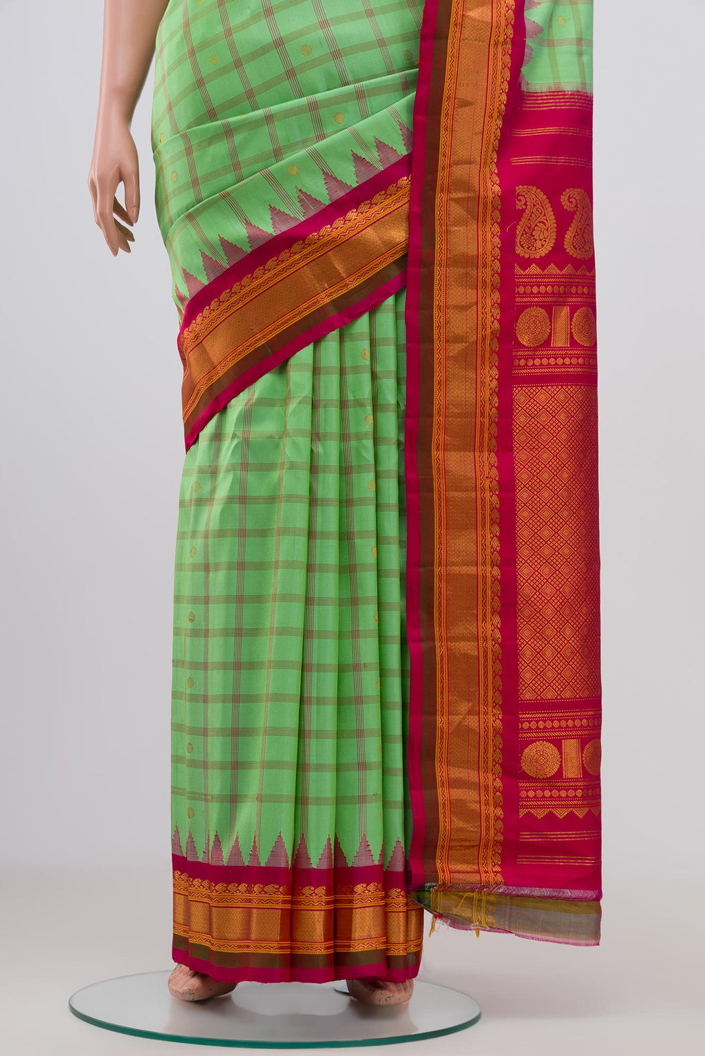 Pleats and pallu of Green Gadwal Silk Saree with Zari Butta on the body and Zari Border. 