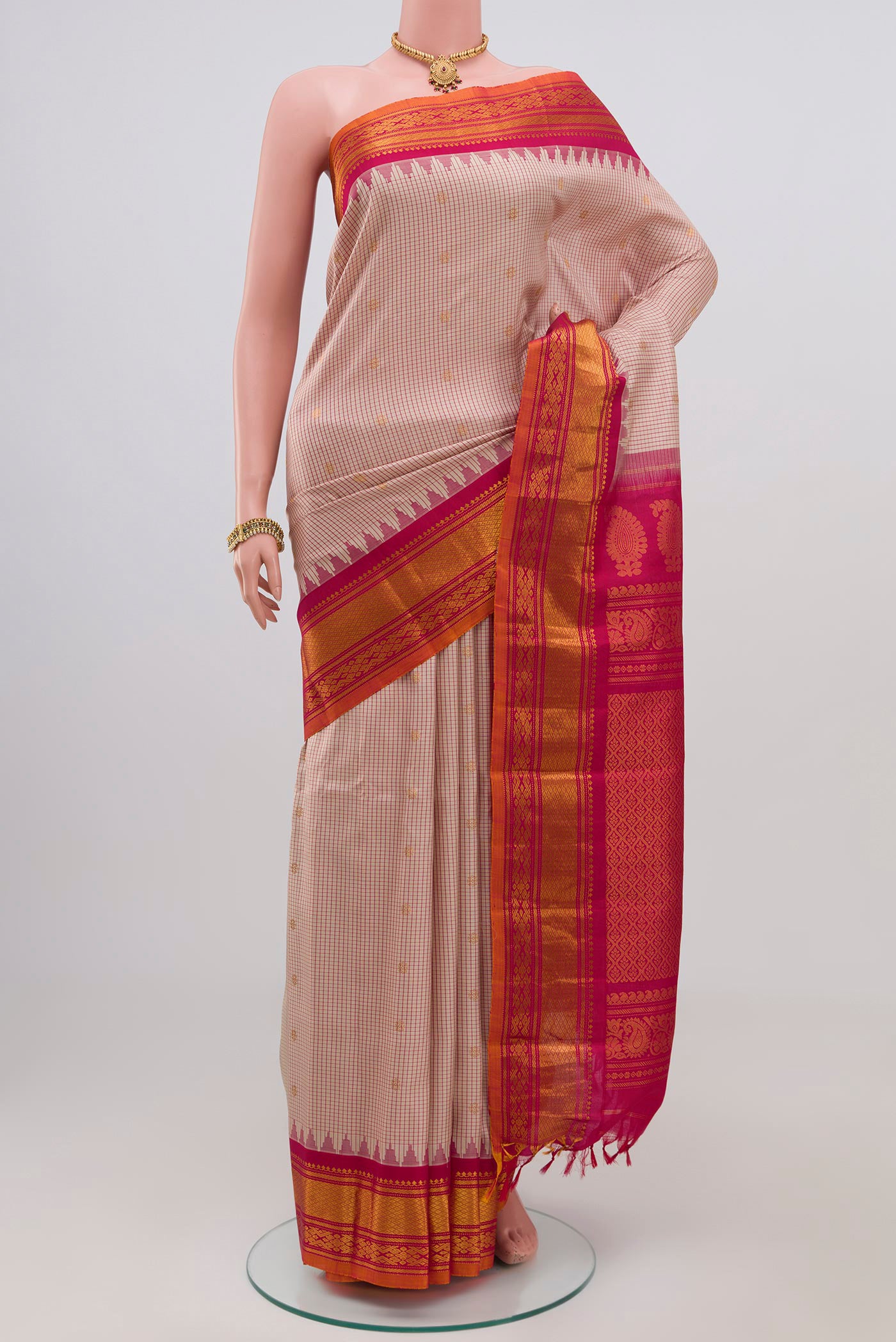 Cream Gadwal Silk Saree with Checked design on the body and Zari Border.  displayed on a mannequin