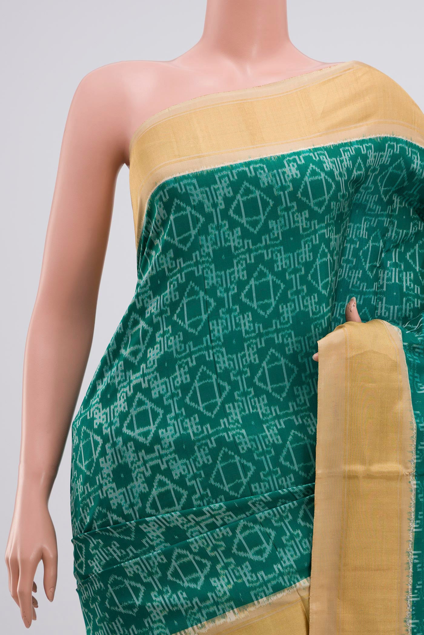 Border image of Green Pochampally Silk Saree with Ikat Print on the body and Zari Border. 