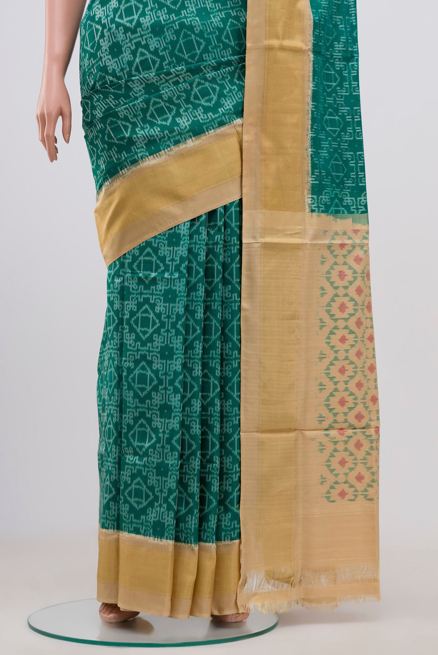 Pleats and pallu of Green Pochampally Silk Saree with Ikat Print on the body and Zari Border. 