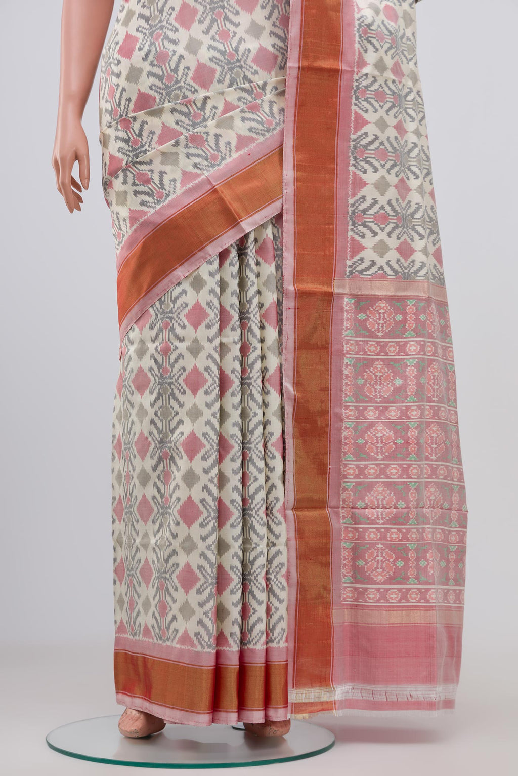 Pleats and pallu of Cream Pochampally Silk Saree with Ikat design on the body and Zari Border. 