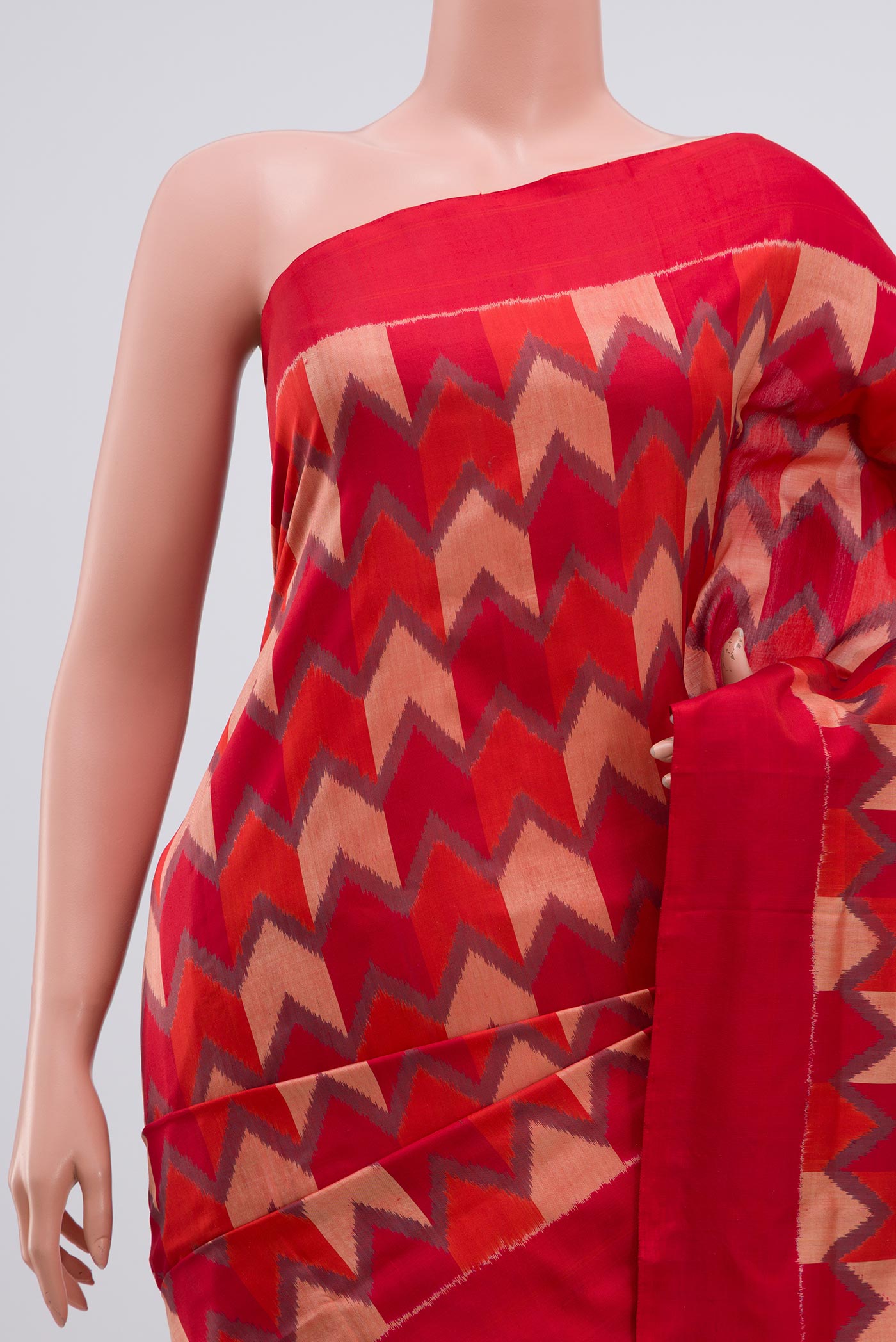 Border image of Red Pochampally Silk Saree with Ikat Print on the body and Plain Border. 