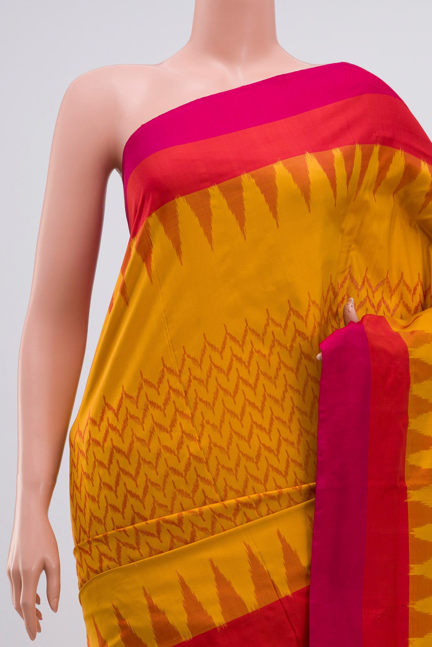 Border image of Mustard Pochampally Silk Saree with Ikat Print on the body and Plain Border. 