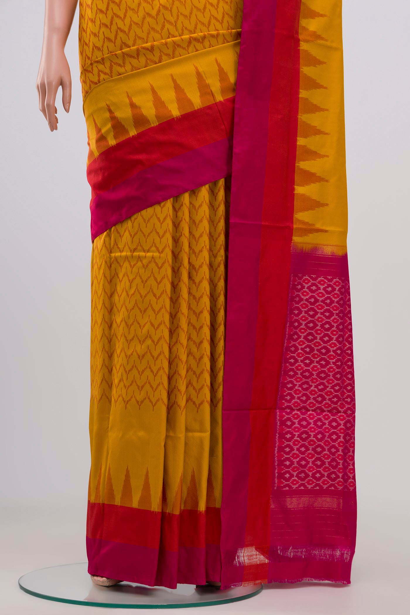 Pleats and pallu of Mustard Pochampally Silk Saree with Ikat Print on the body and Plain Border. 