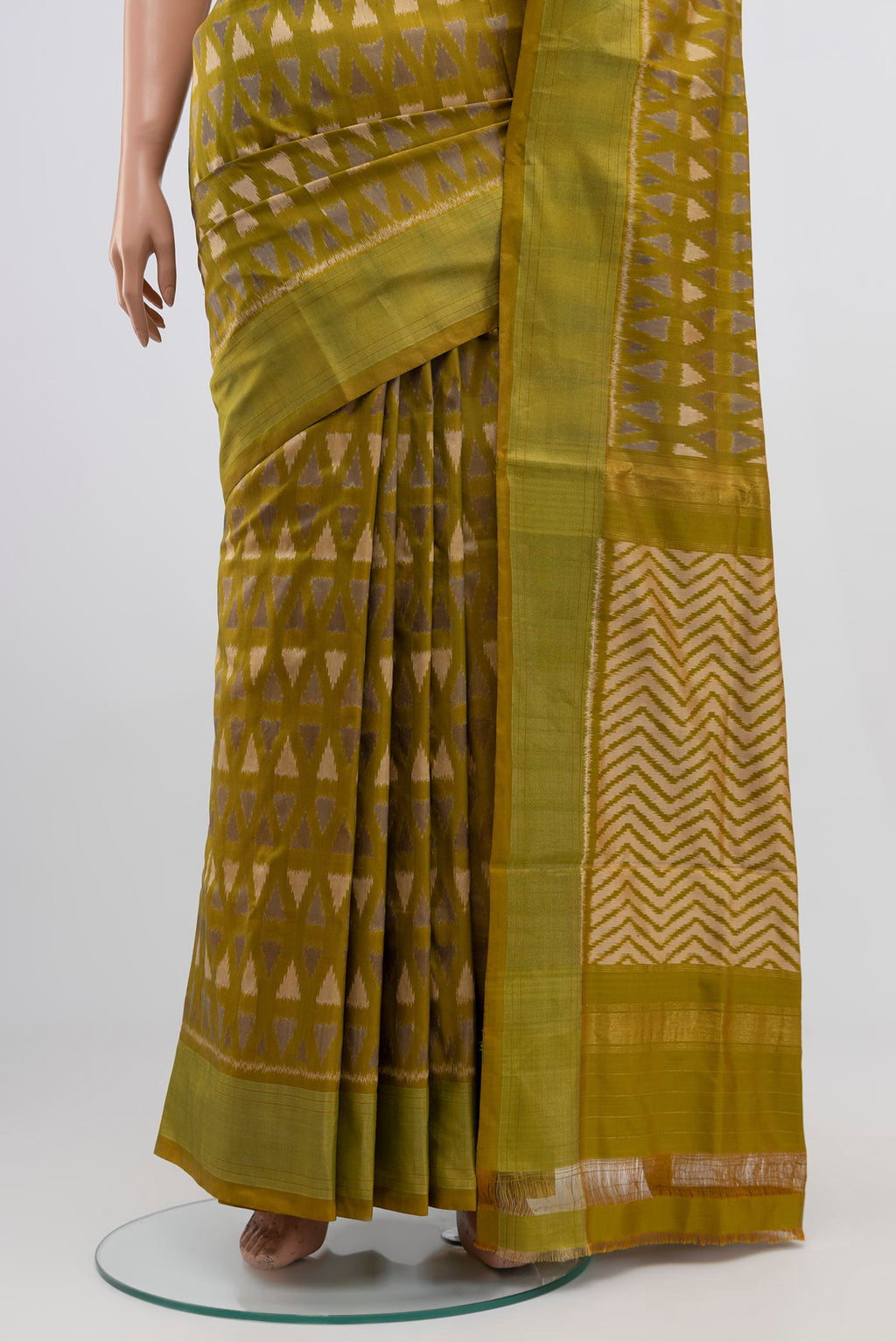 Pleats and pallu of Green Pochampally Silk Saree with Ikat Print on the body and Zari Border. 