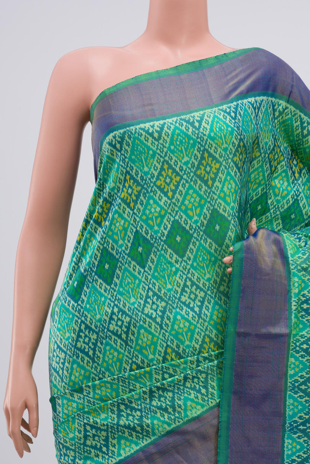 Border image of Light Green Pochampally Silk Saree with Ikat Print on the body and Zari Border. 