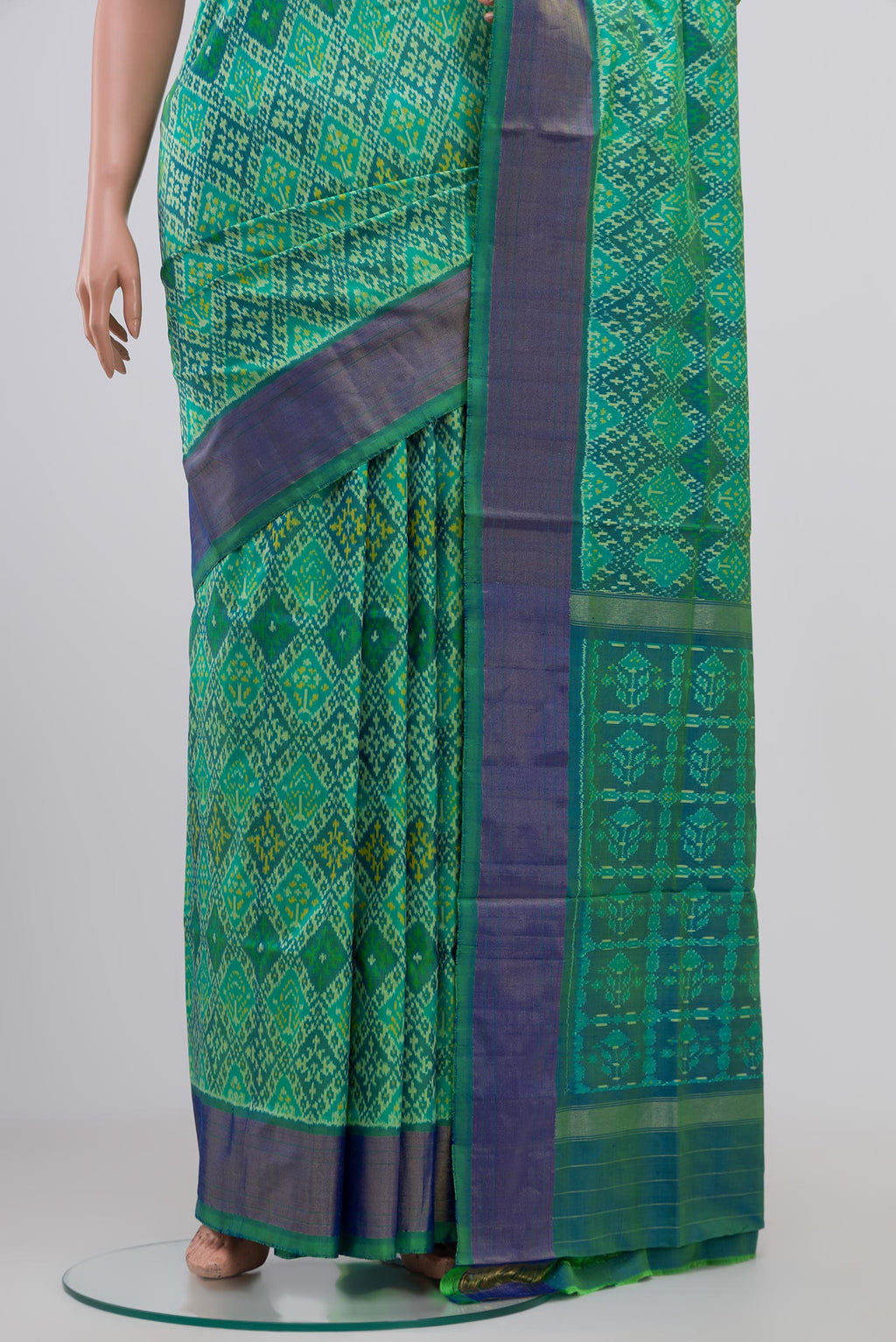 Pleats and pallu of Light Green Pochampally Silk Saree with Ikat Print on the body and Zari Border. 