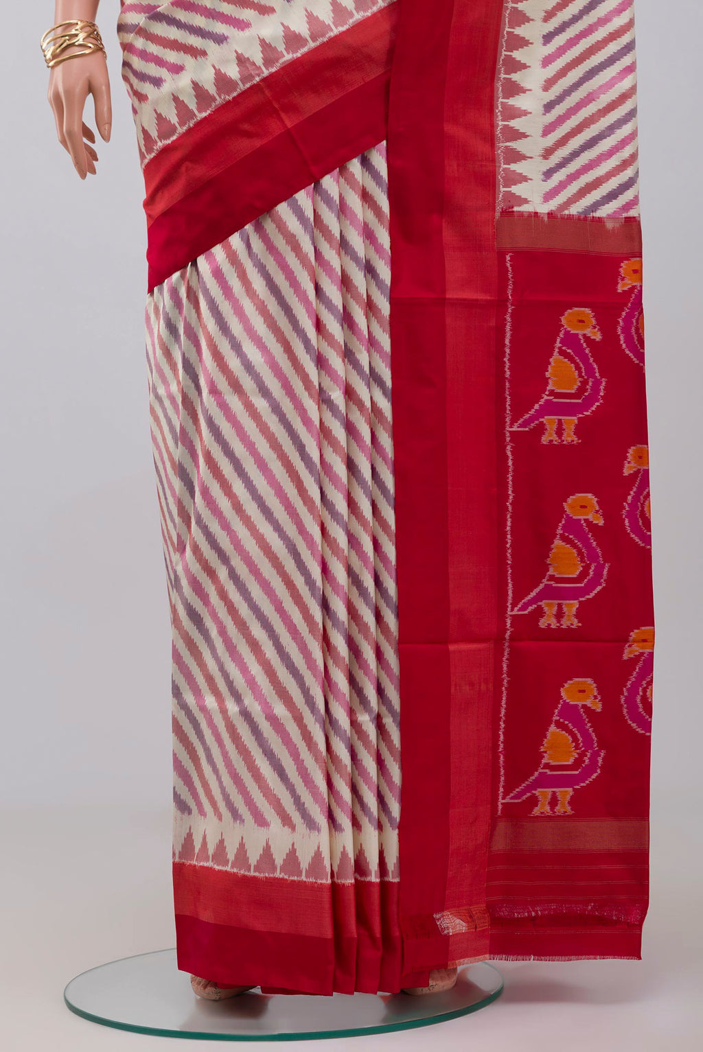 Pleats and pallu of Cream Pochampally Silk Saree with Ikat design on the body and Plain Border. 