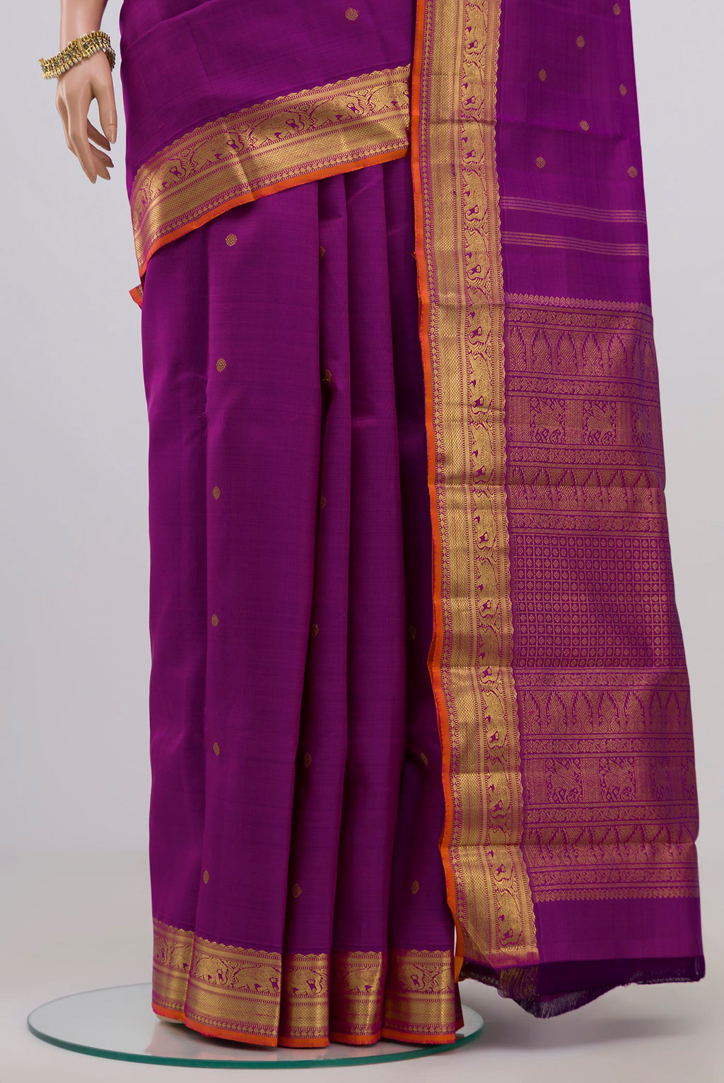 Pleats and pallu of Pure Silk Pure Zari Purple Kanjivaram Saree with Zari Butta on the body and Zari Border. 