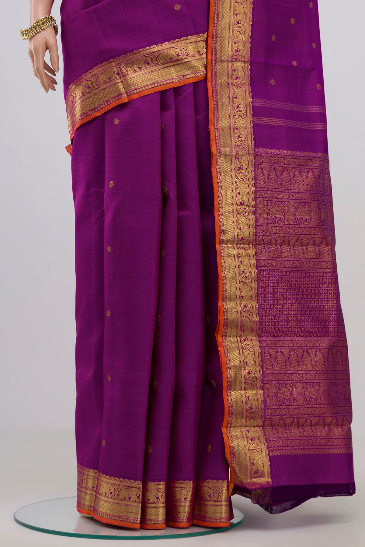 Pleats and pallu of Pure Silk Pure Zari Purple Kanjivaram Saree with Zari Butta on the body and Zari Border. 