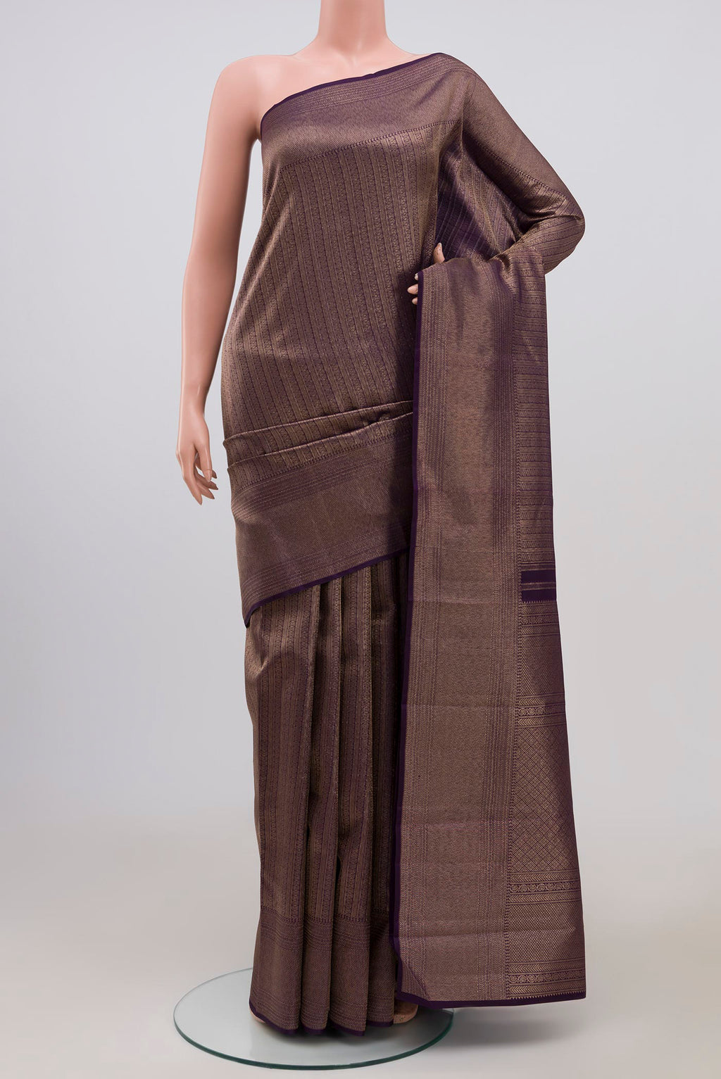 Violet Kanchipuram Saree with Zari Brocade on the body and Zari Border.  displayed on a mannequin