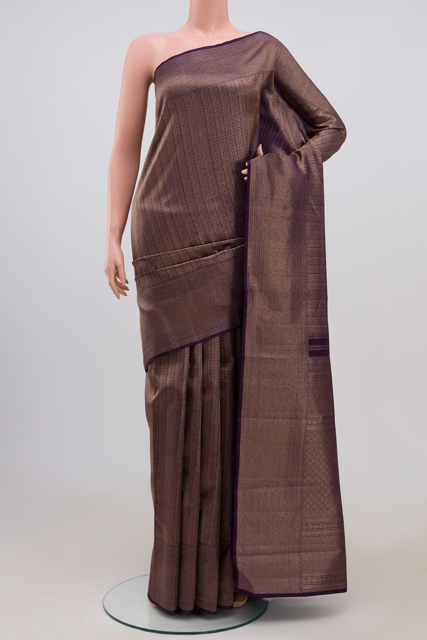 Violet Kanchipuram Saree with Zari Brocade on the body and Zari Border.  displayed on a mannequin