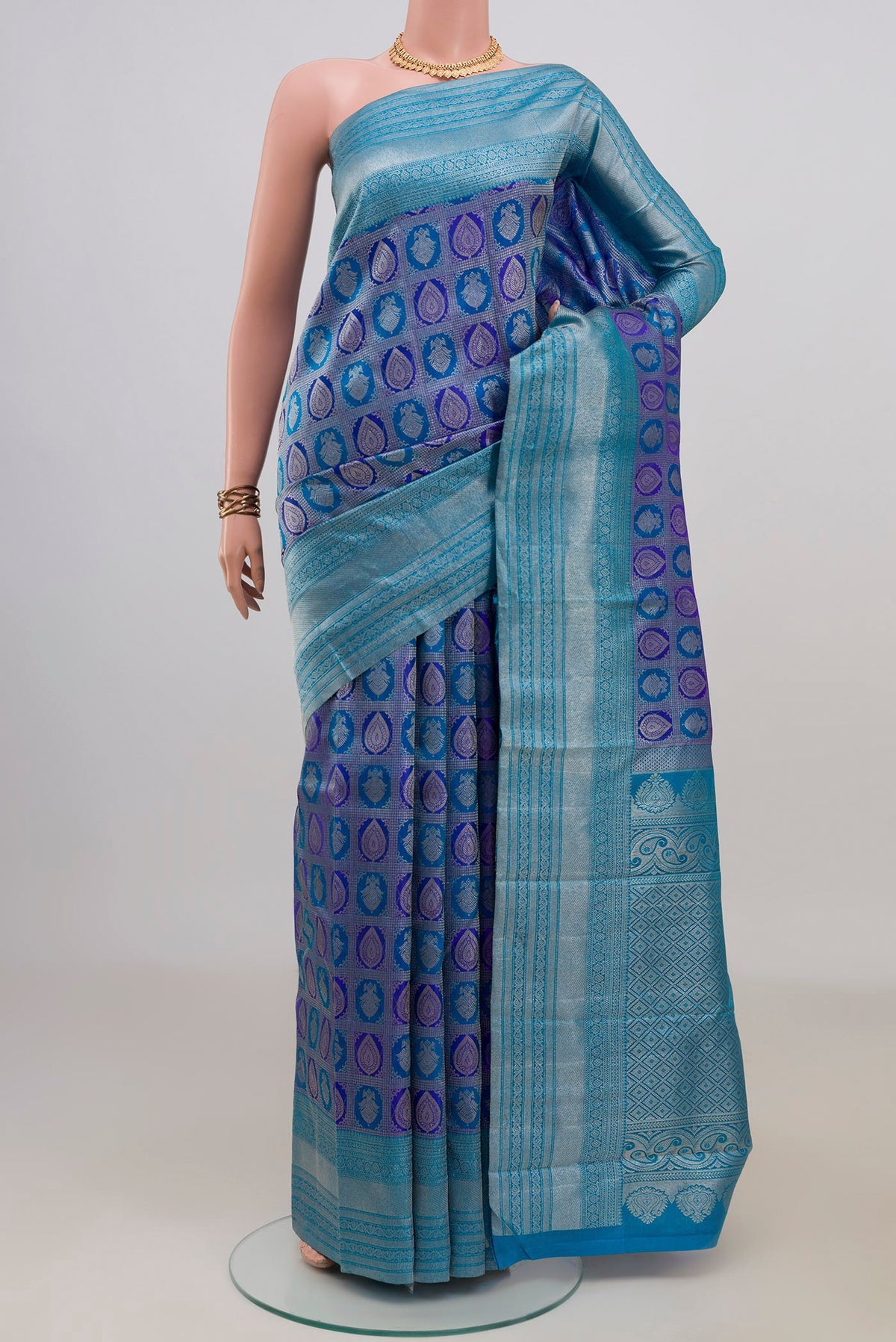 Pure Silk Royal Blue Kanchipuram Saree with Zari Brocade on the body and Zari Border.  displayed on a mannequin
