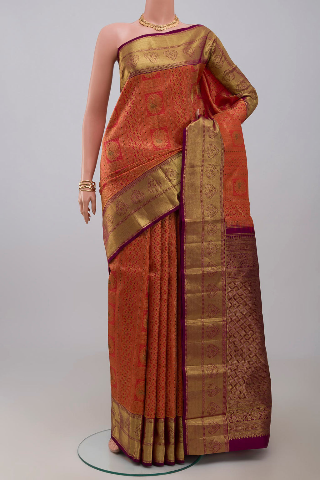 Pink Kanjivaram Silk Saree with Zari Brocade on the body and Zari Border.  displayed on a mannequin