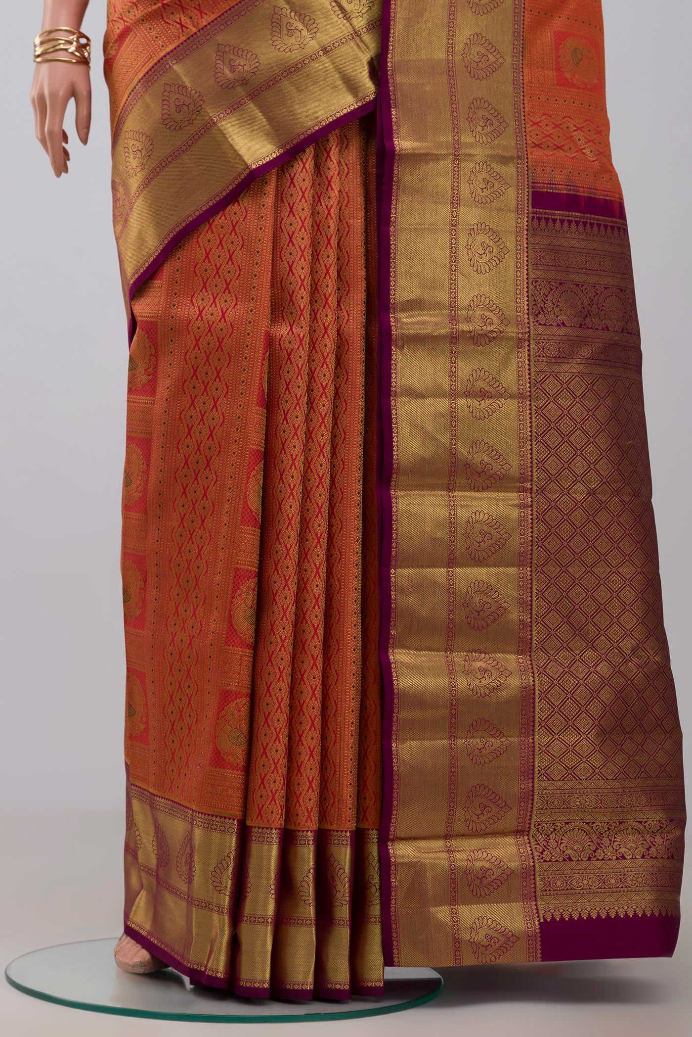 Pleats and pallu of Pink Kanjivaram Silk Saree with Zari Brocade on the body and Zari Border. 