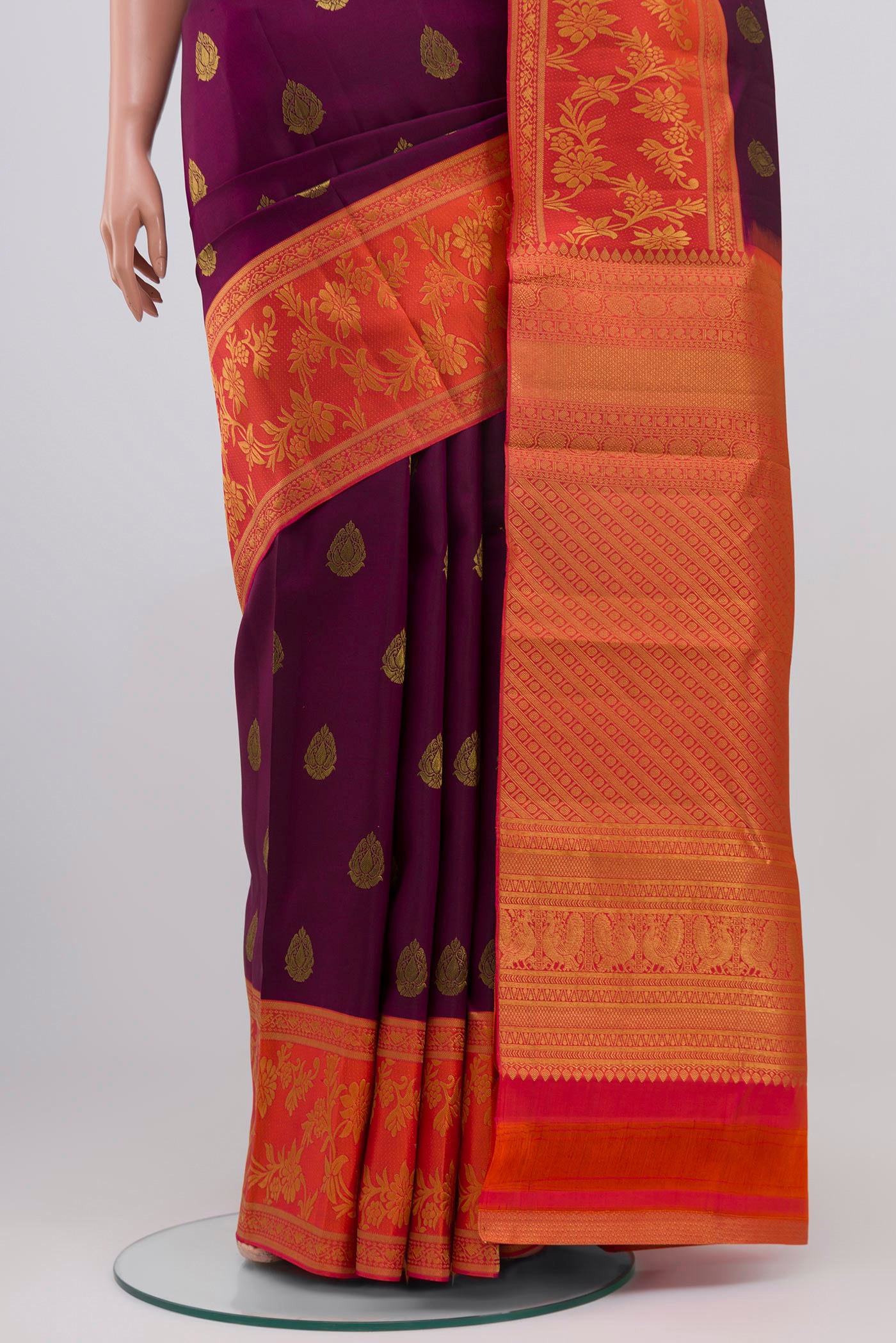 Pleats and pallu of Purple Kanjivaram Saree with Zari Butta on the body and Fancy Border. 