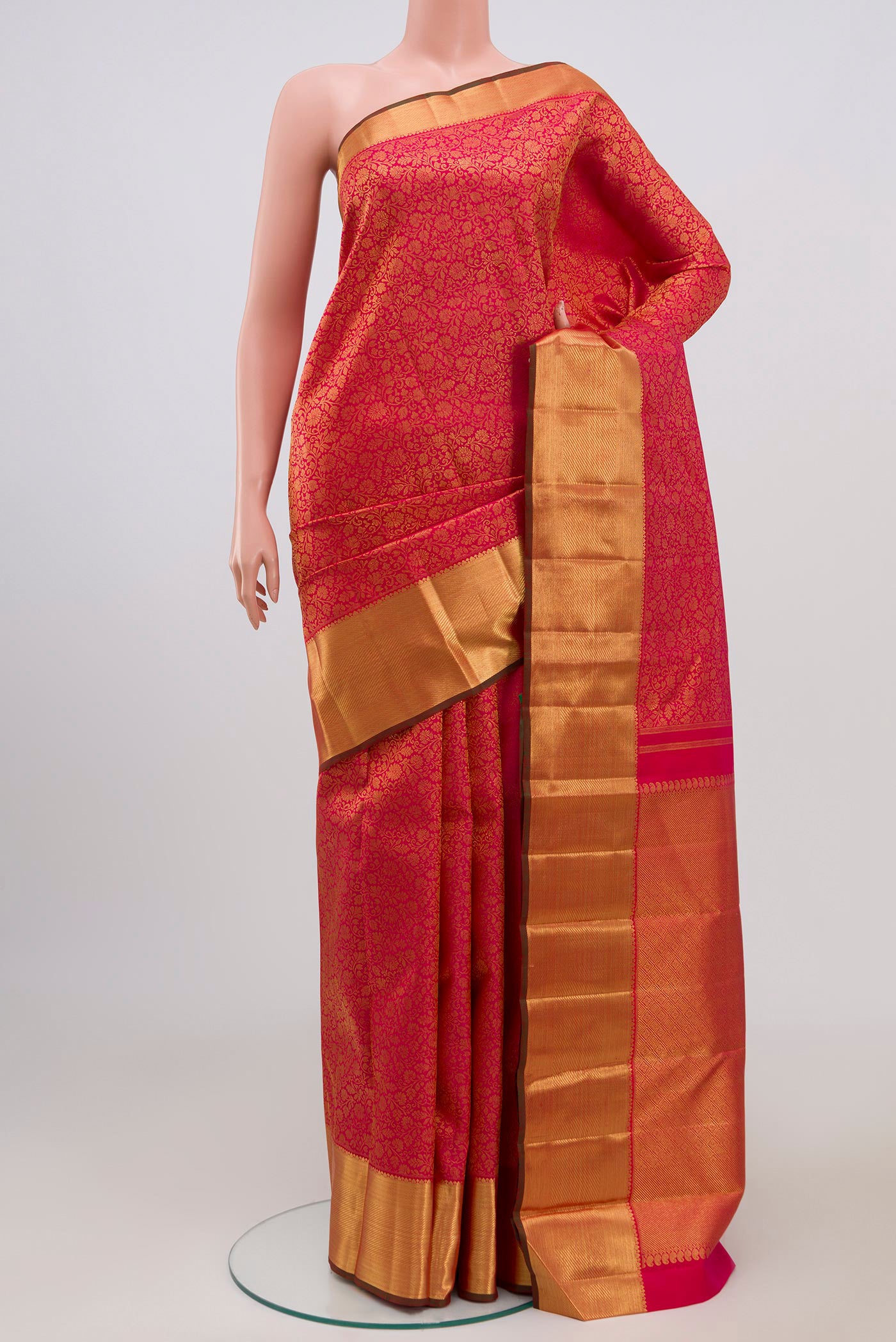 Pure Silk Pure Zari Pink Kanjivaram Saree with Zari Brocade on the body and Zari Border.  displayed on a mannequin