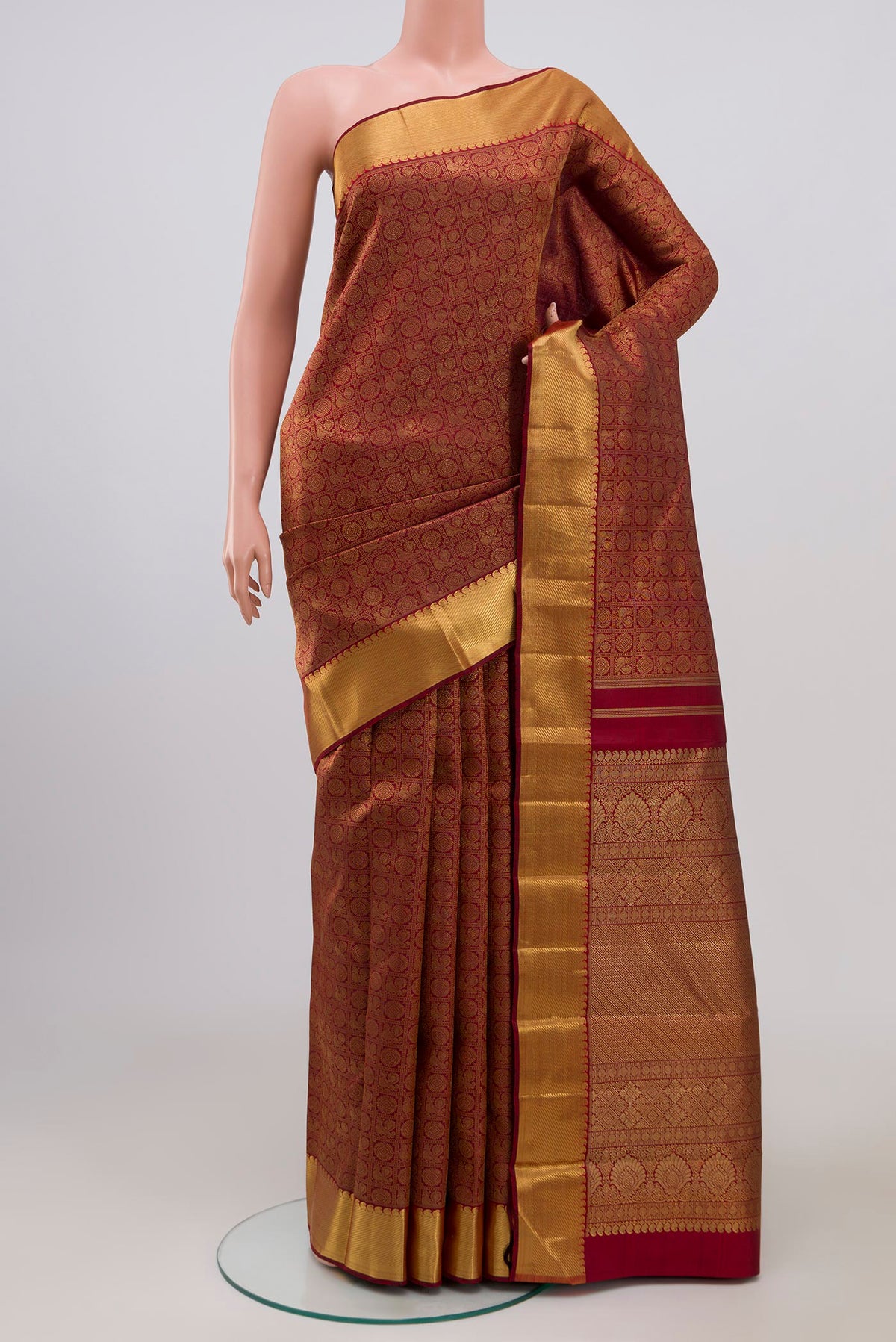 Pure Silk Pure Zari Maroon Kanjivaram Saree with Zari Brocade on the body and Zari Border.  displayed on a mannequin