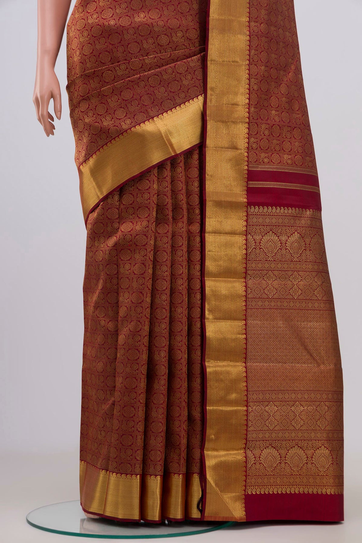 Pleats and pallu of Pure Silk Pure Zari Maroon Kanjivaram Saree with Zari Brocade on the body and Zari Border. 