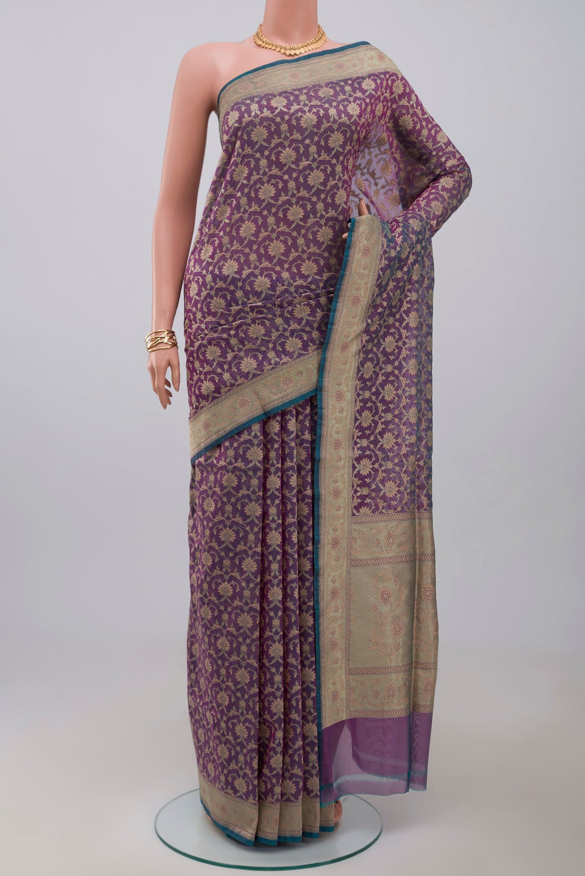 Purple Banarasi Saree with Fancy on the body and Fancy Border.  displayed on a mannequin