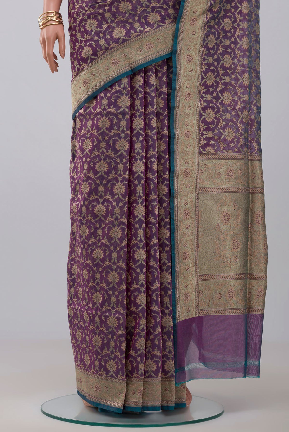 Pleats and pallu of Purple Banarasi Saree with Fancy on the body and Fancy Border. 