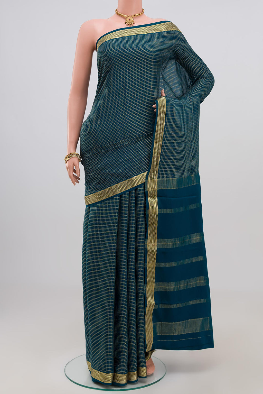 Blue Mysore Crepe Saree with Checked design on the body and Zari Border.  displayed on a mannequin