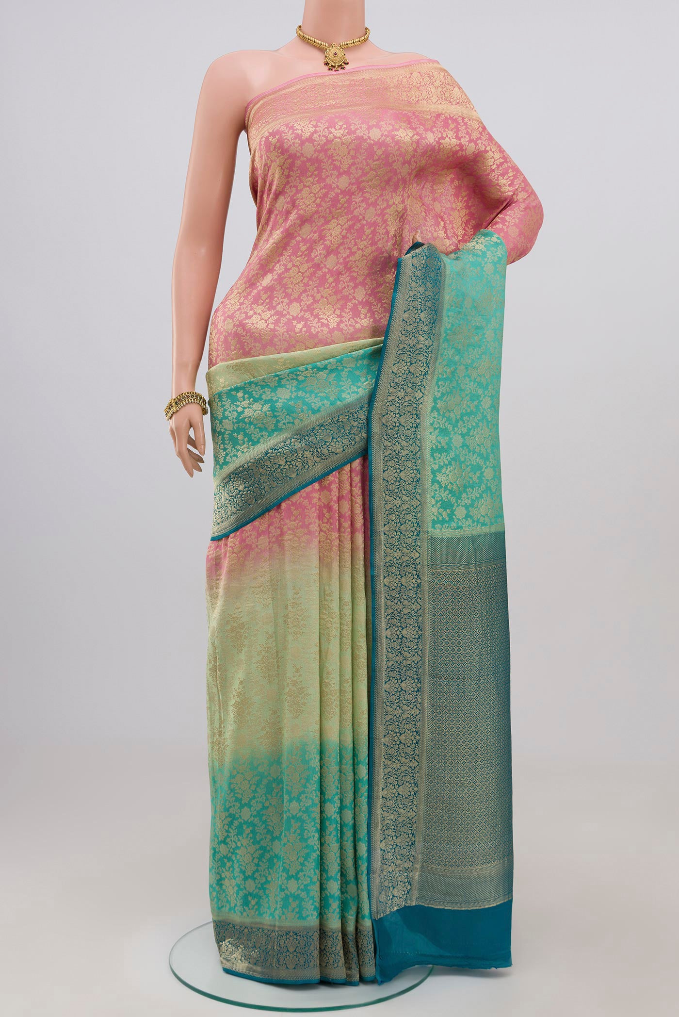 Multi Color Crepe Saree with Fancy on the body and Zari Border.  displayed on a mannequin