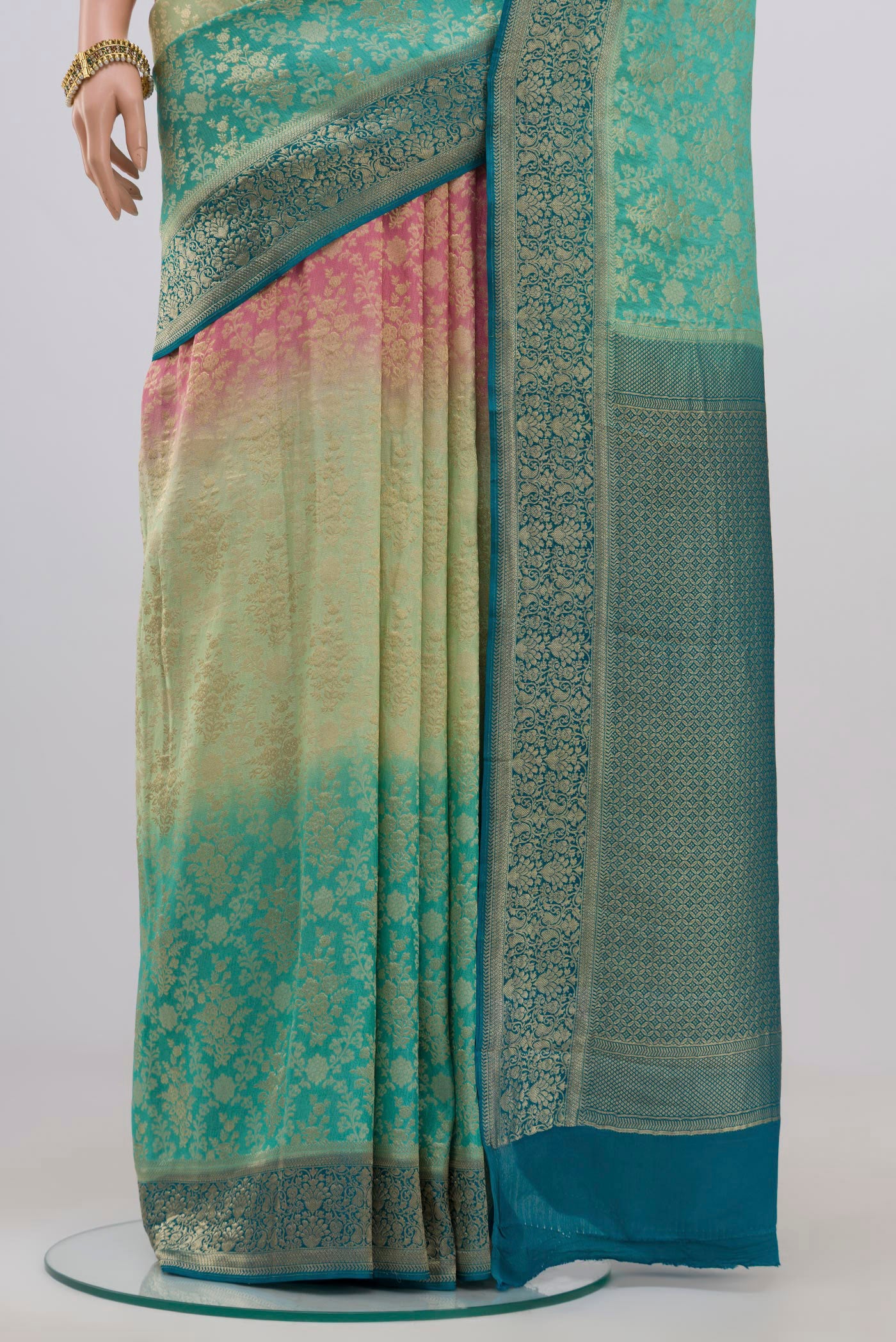 Pleats and pallu of Multi Color Crepe Saree with Fancy on the body and Zari Border. 