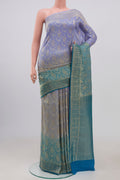 Multi Color Georgette Saree with Fancy on the body and Zari Border.  displayed on a mannequin
