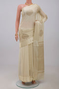 Cream Crepe Saree with Zari Butta on the body and Thin Zari Line.  displayed on a mannequin