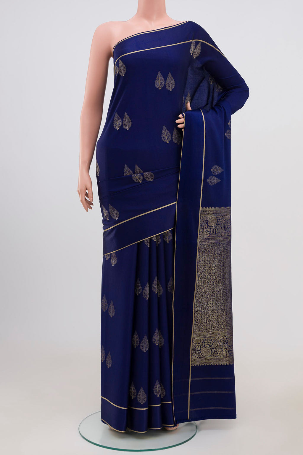 Navy Blue Mysore Crepe Saree with Zari Butta on the body and Thin Zari Line.  displayed on a mannequin
