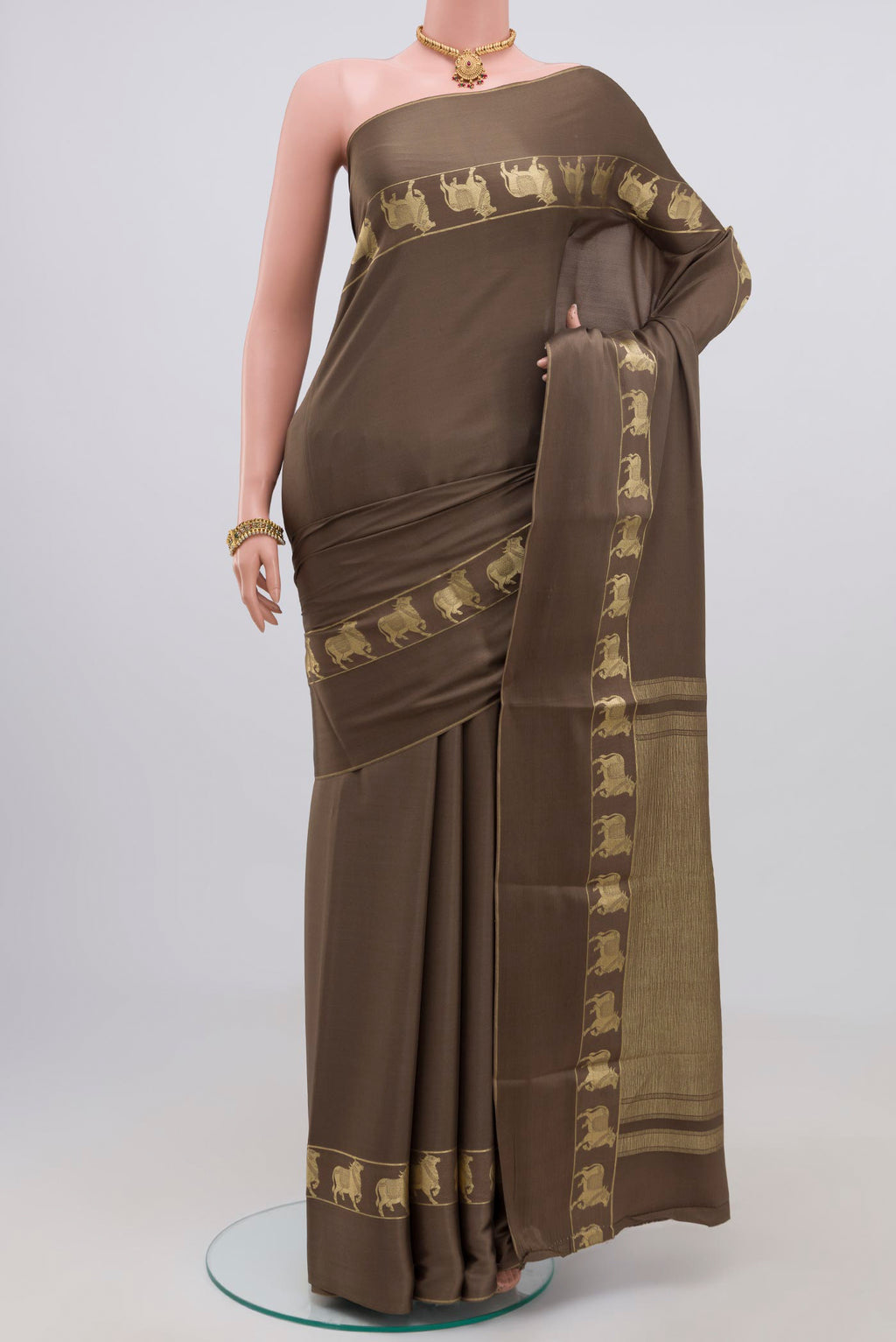 Grey Crepe Saree with Plain Body and Fancy Border.  displayed on a mannequin