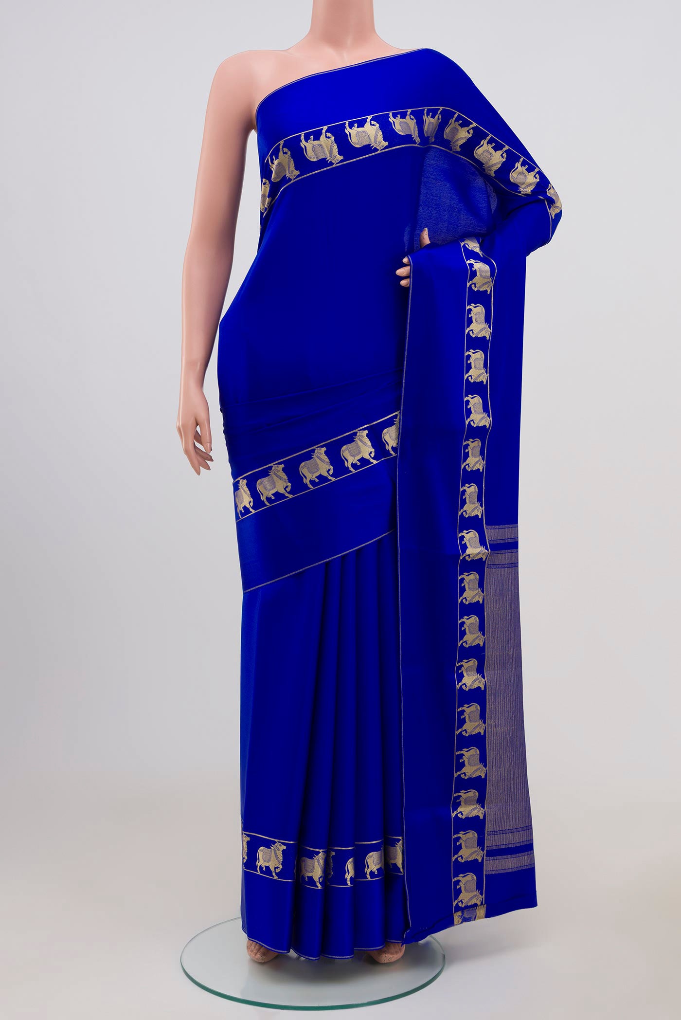 Blue Mysore Crepe Saree with Plain Body and Zari Border.  displayed on a mannequin