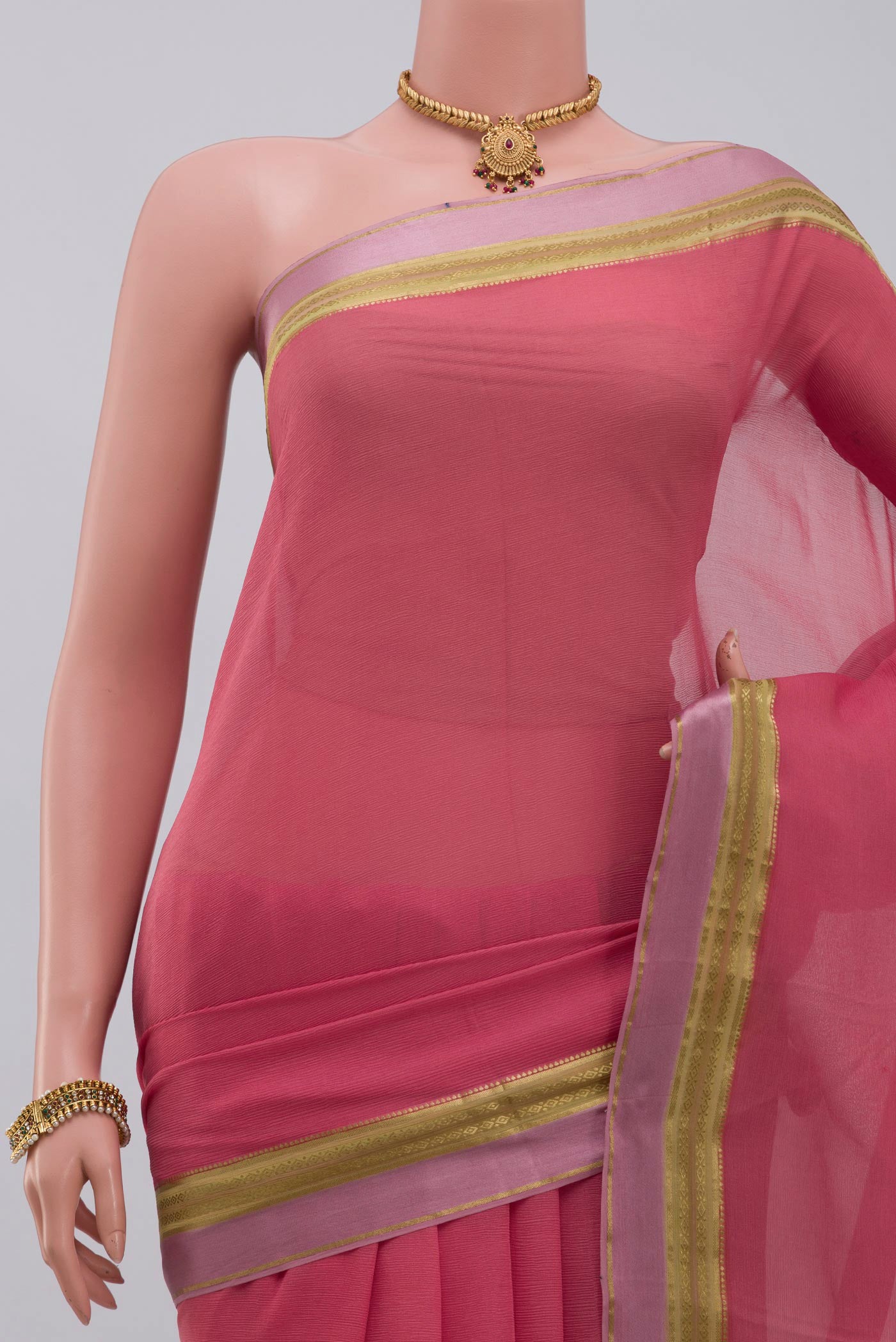Border image of Peach Chiffon Saree with Plain Body and Zari Border. 