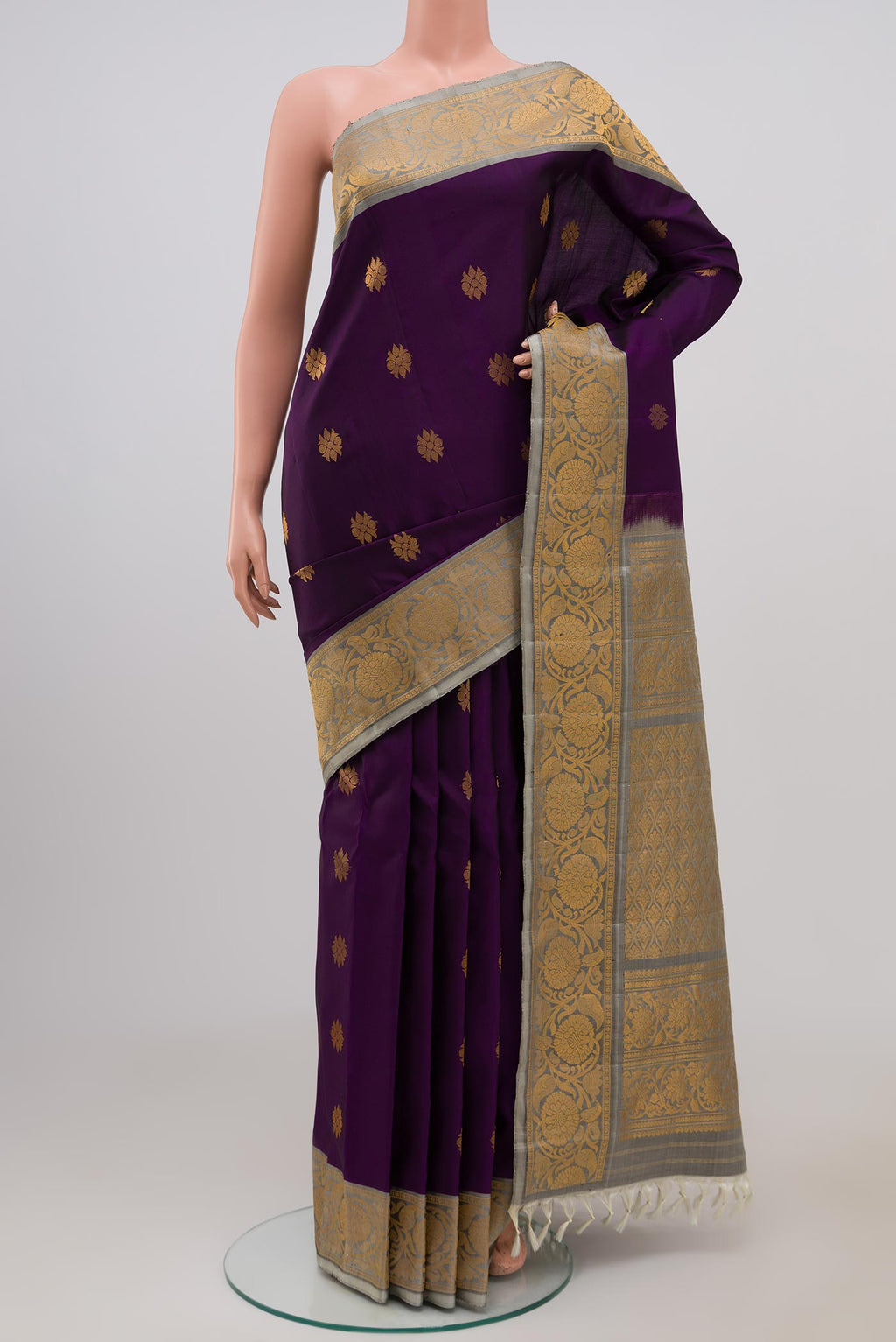 Purple Gadwal Silk Saree with Zari Butta on the body and Zari Border.  displayed on a mannequin