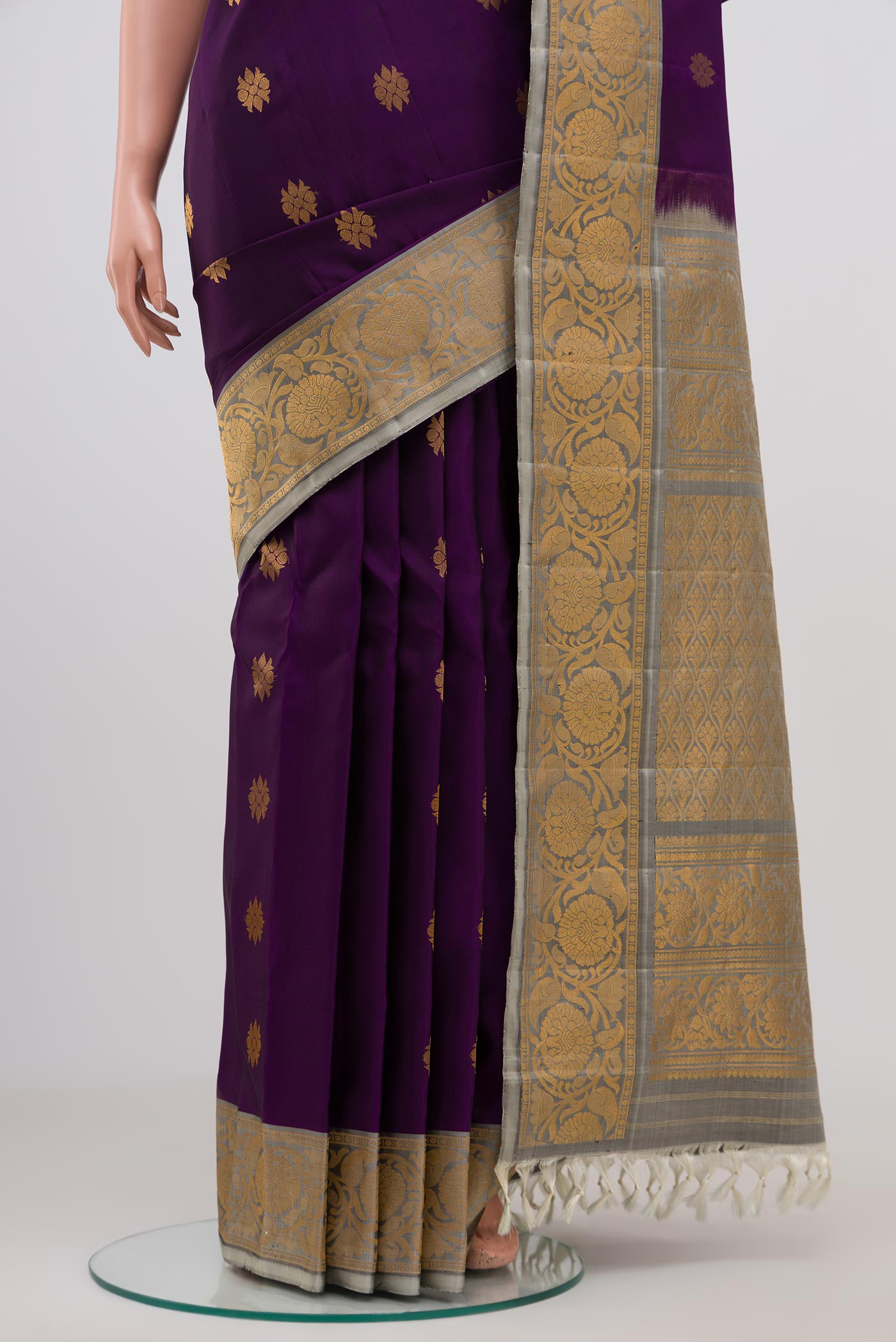 Pleats and pallu of Purple Gadwal Silk Saree with Zari Butta on the body and Zari Border. 